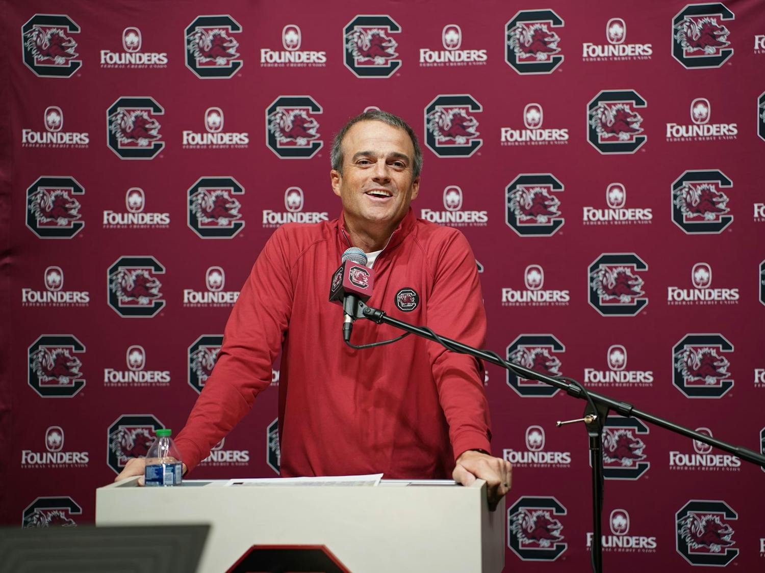 FILE — Head coach Shane Beamer speaks to members of the media at the Long Family Football Operations Center on Nov. 14, 2023. Beamer recently hired wide receivers coach Mike Furrey and run game coordinator and tight ends coach Shawn Elliott to the Gamecocks' football staff for the upcoming season.