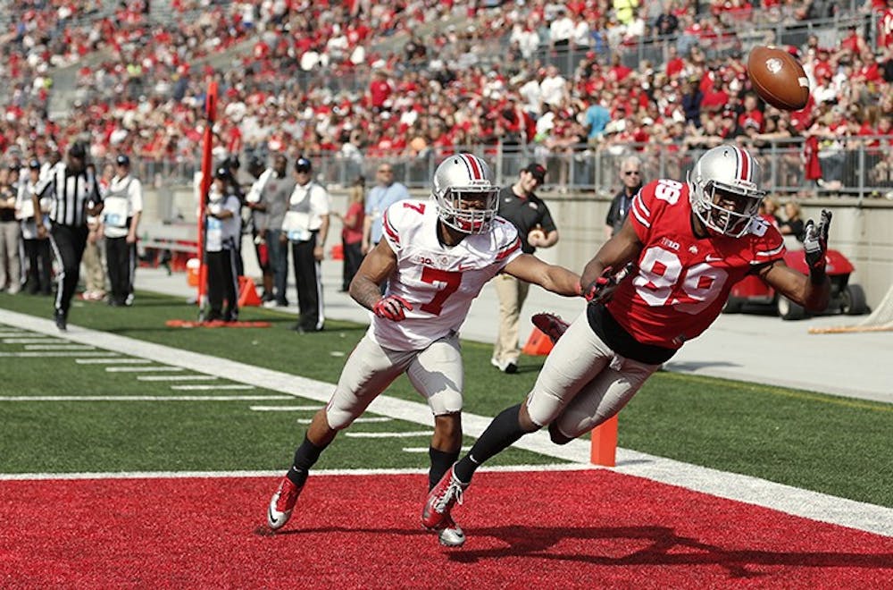 Ohio State&apos;s Jeff Greene (89), defended by Damon Webb (7), can&apos;t quite reach the ball on the final play of the Buckeyes&apos; Spring Football Game on Saturday, April 18, 2015, in Columbus, Ohio. (Fred Squillante/Columbus Dispatch/TNS)
