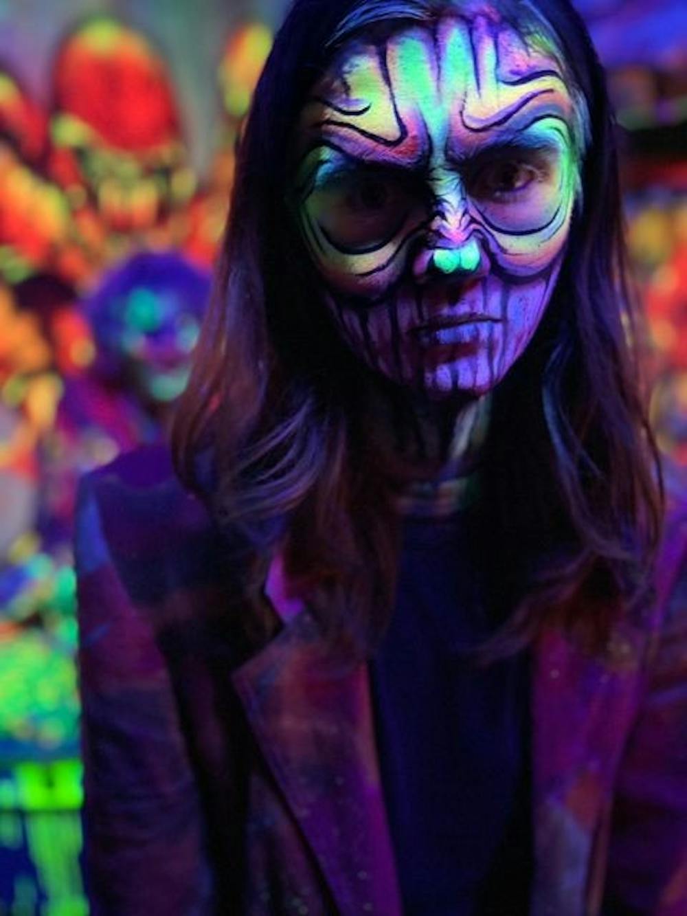 An actor with makeup and special effects poses in the haunted house during the 2022 run of the Halloween attraction. Upon completion actors get into character and mentally prepare themselves to become their character and provide the best experience for the guests.
