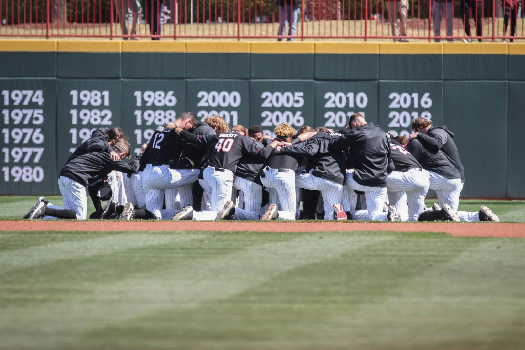 FILE—The South Carolina baseball team huddles before the game against Texas on March 13, 2022, at Founders Park in Columbia SC.