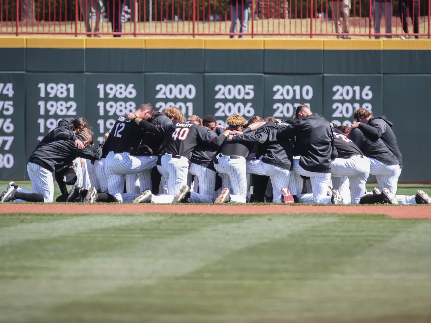 FILE—The South Carolina baseball team huddles before the game against Texas on March 13, 2022, at Founders Park in Columbia SC.