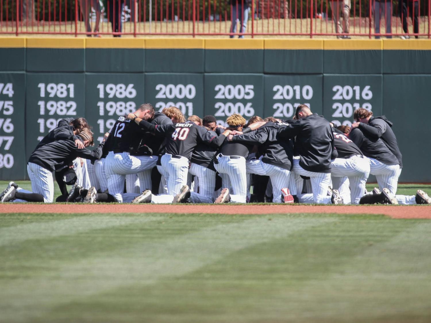 FILE—The South Carolina baseball team huddles before the game against Texas on March 13, 2022, at Founders Park in Columbia SC.