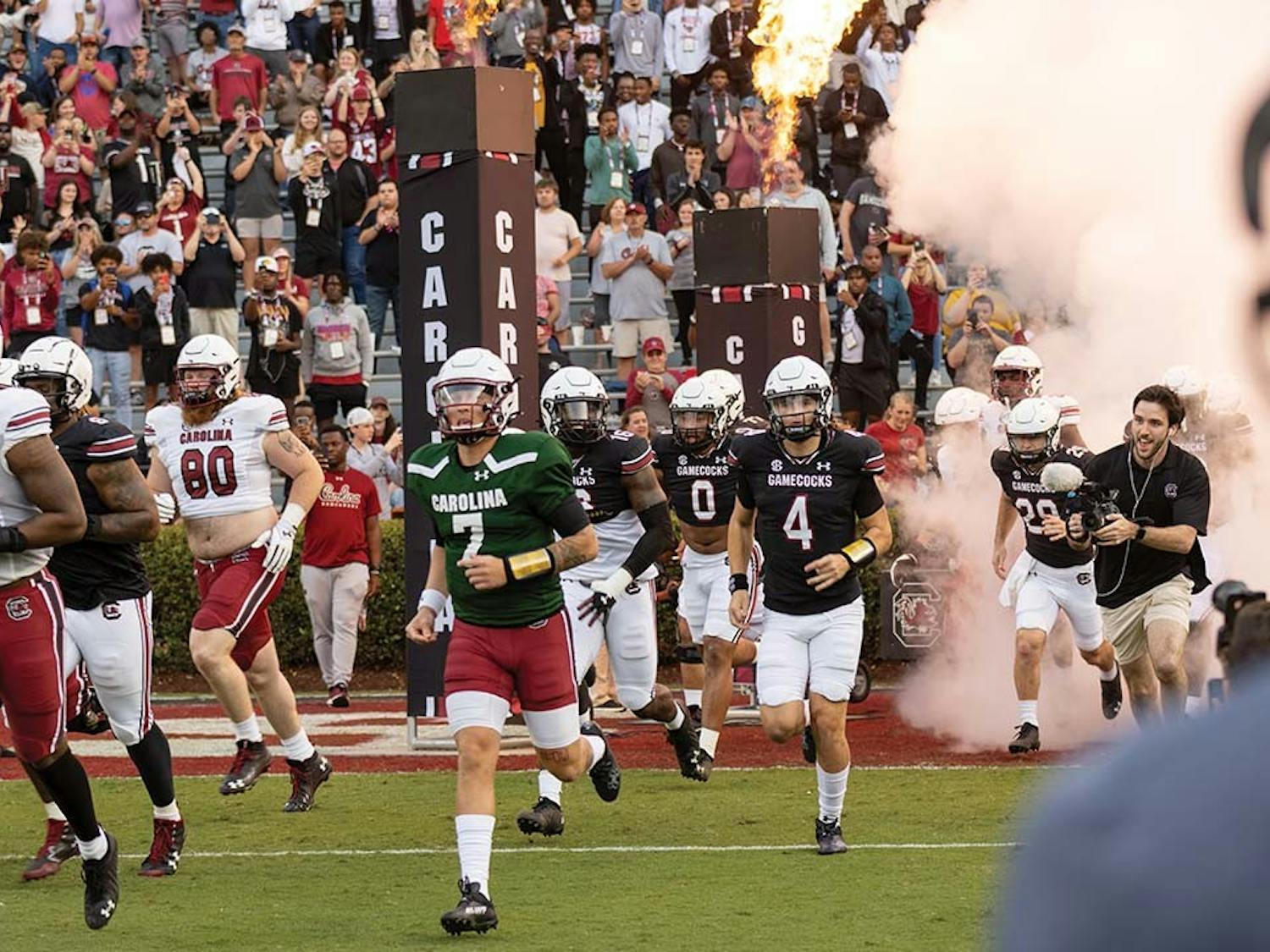 Redshirt junior quarterback Spencer Rattler runs out of the tunnel at Williams-Brice Stadium during the Garnet & Black football game on April 16, 2022. The Garnet team defeated the Black team 20-13.