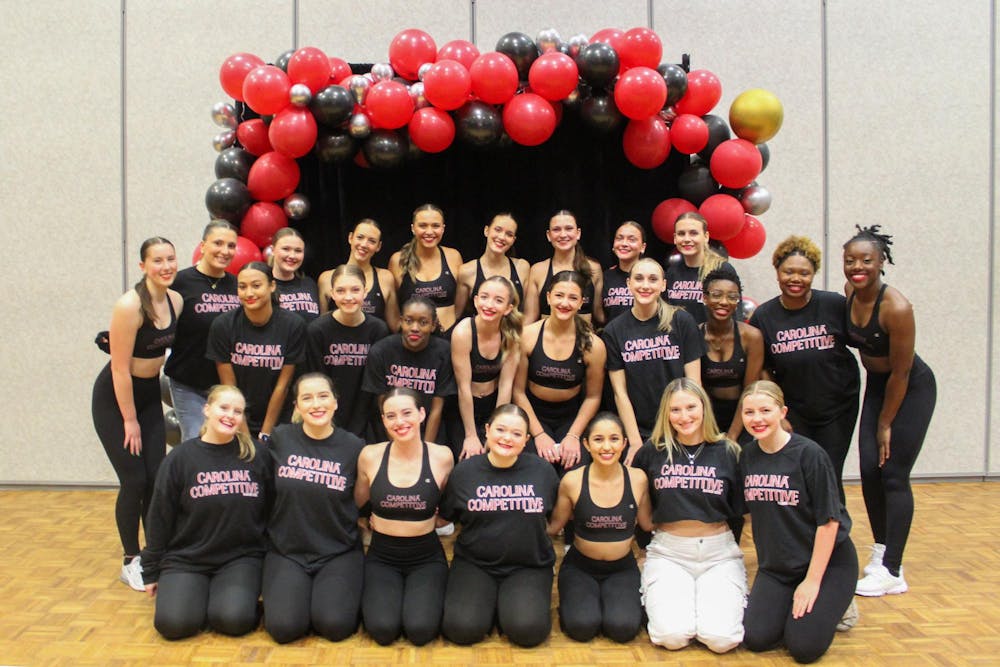 <p>The Carolina Competitive Dance Club poses for a group picture on Dec. 5, 2023, in the Russell House Ballroom. The 2023-24 academic year is the club's first year on campus.</p>