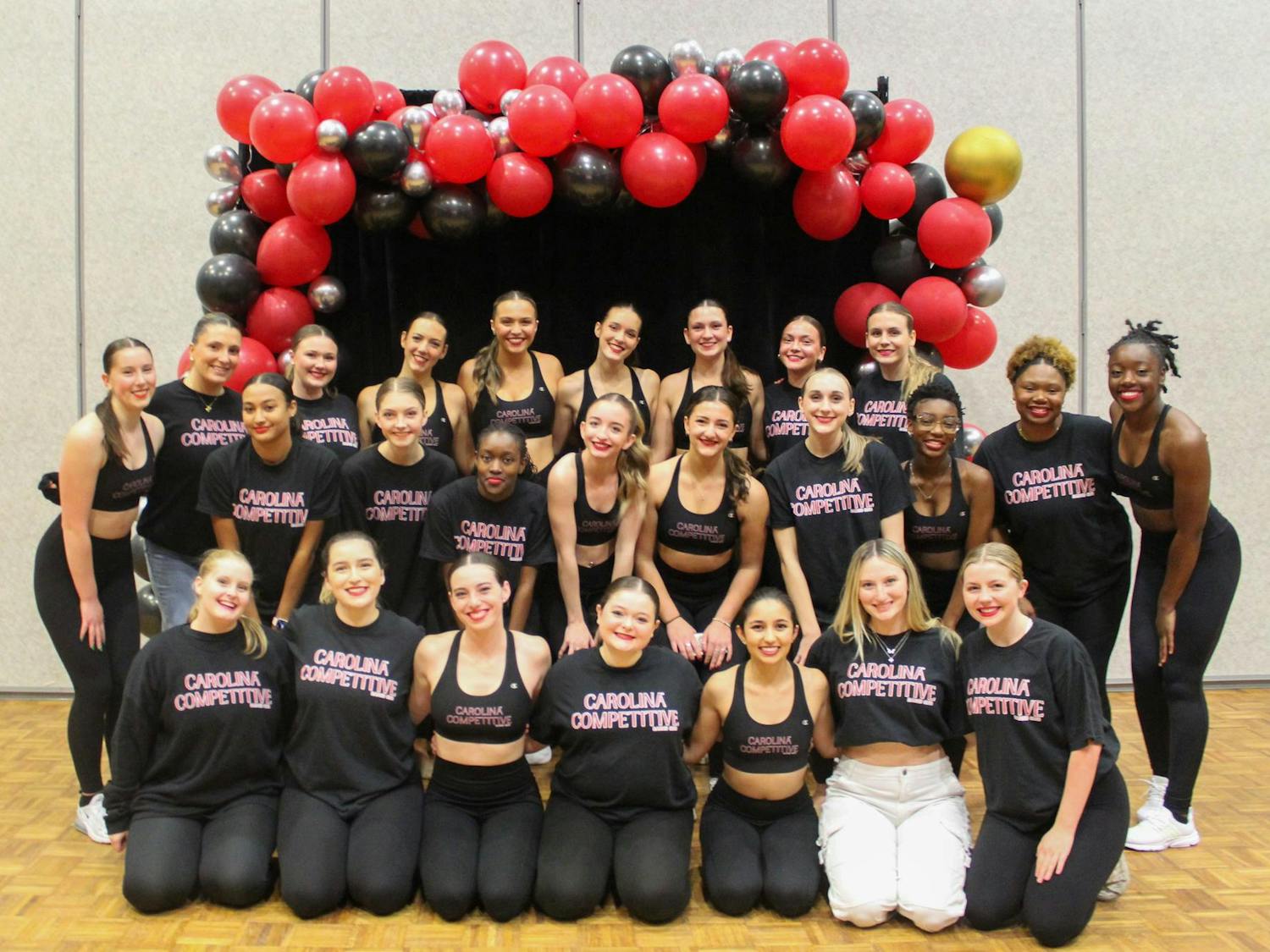The Carolina Competitive Dance Club poses for a group picture on Dec. 5, 2023, in the Russell House Ballroom. The 2023-24 academic year is the club's first year on campus.