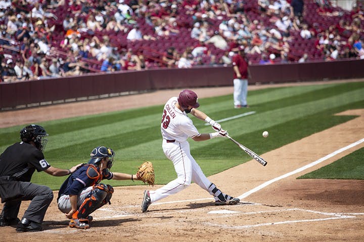 Senior Chris Cullen hits the ball during the Saturday game against Auburn at Founders Park.
