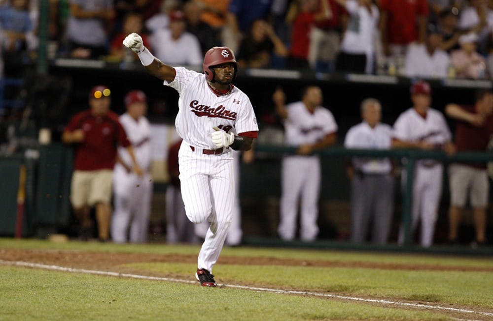 South Carolina&apos;s Jackie Bradley Jr. celebrates his hit in the 12th inning against Oklahoma during the College World Series at Rosenblatt Stadium in Omaha, Nebraska, Thursday, June 24, 2010. (Gerry Melendez/The State/MCT)
