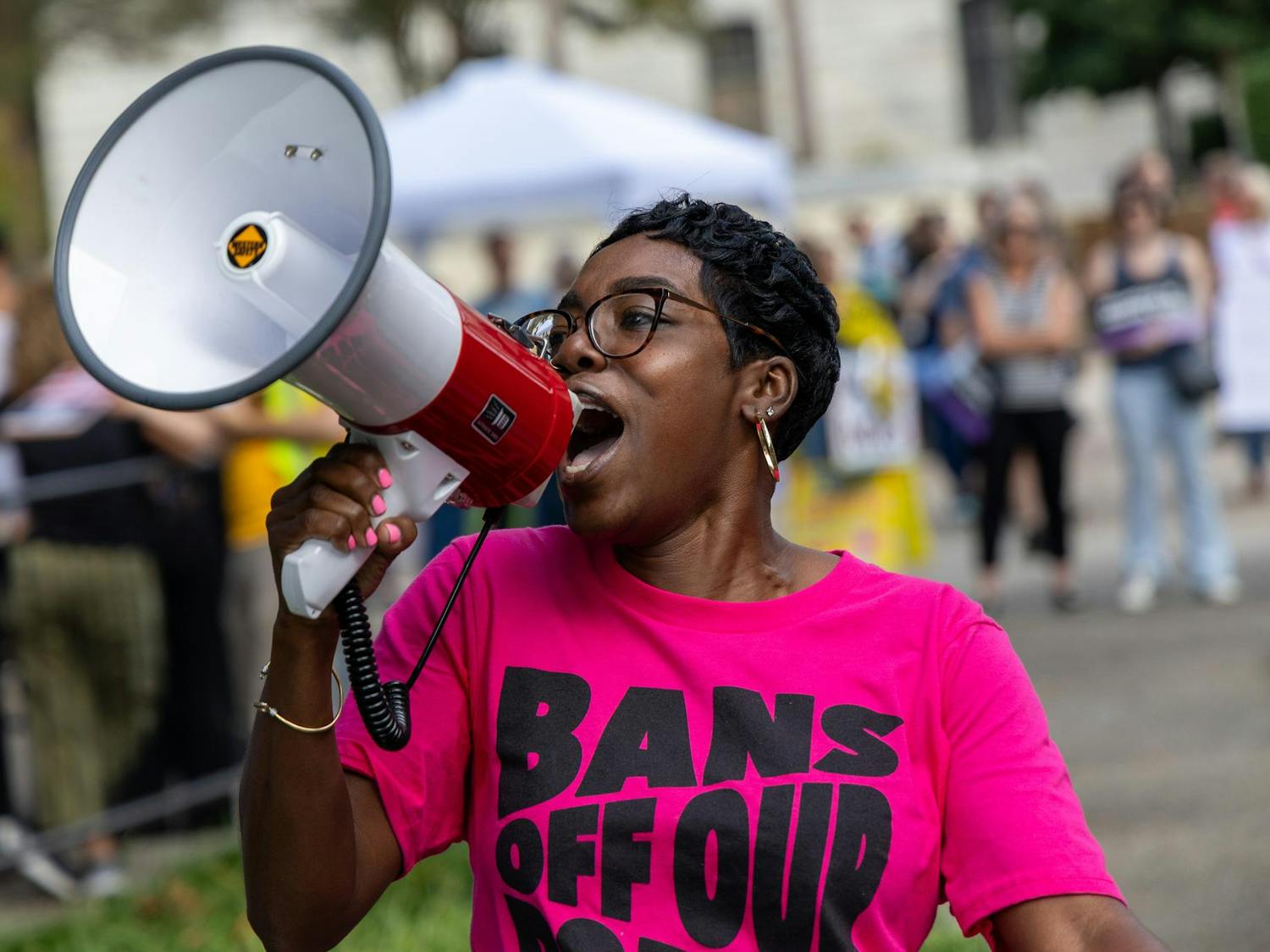 Planned Parenthood volunteer Shaterica Neal chants into a megaphone during a protest outside Gressette Building against S.B. 323 on Oct. 1, 2025. Planned Parenthood was one of many organizations who rallied against the new abortion ban bill.