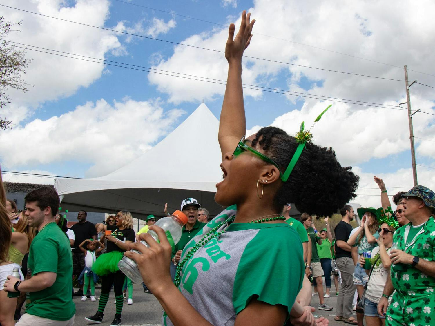 Second-year student Sydnie Taylor cheers and dances along to music performed by Master Splnta with DJ Cannon Banyon at St. Pat's in Five Points in Columbia, South Carolina, on March 16, 2024. Master Splnta and DJ Cannon Banyon kicked off the day on the Fountain Stage and performed multiple times throughout the day.