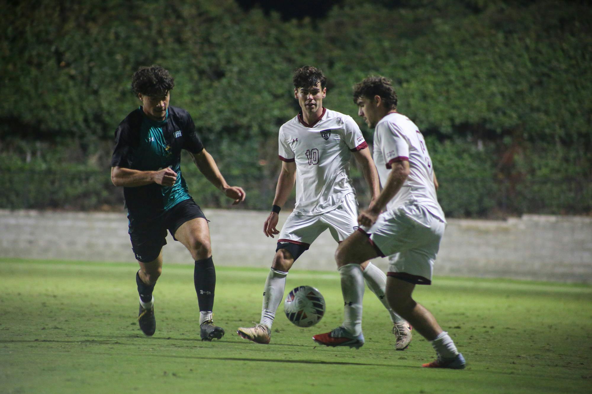 Senior midfielder Ethan Ballek passes the ball to senior midfielder Alexander Stjernegaard at Eugene E. Stone III Stadium on Oct. 26, 2025. The Gamecocks lost to the Chanticleers 3-1.