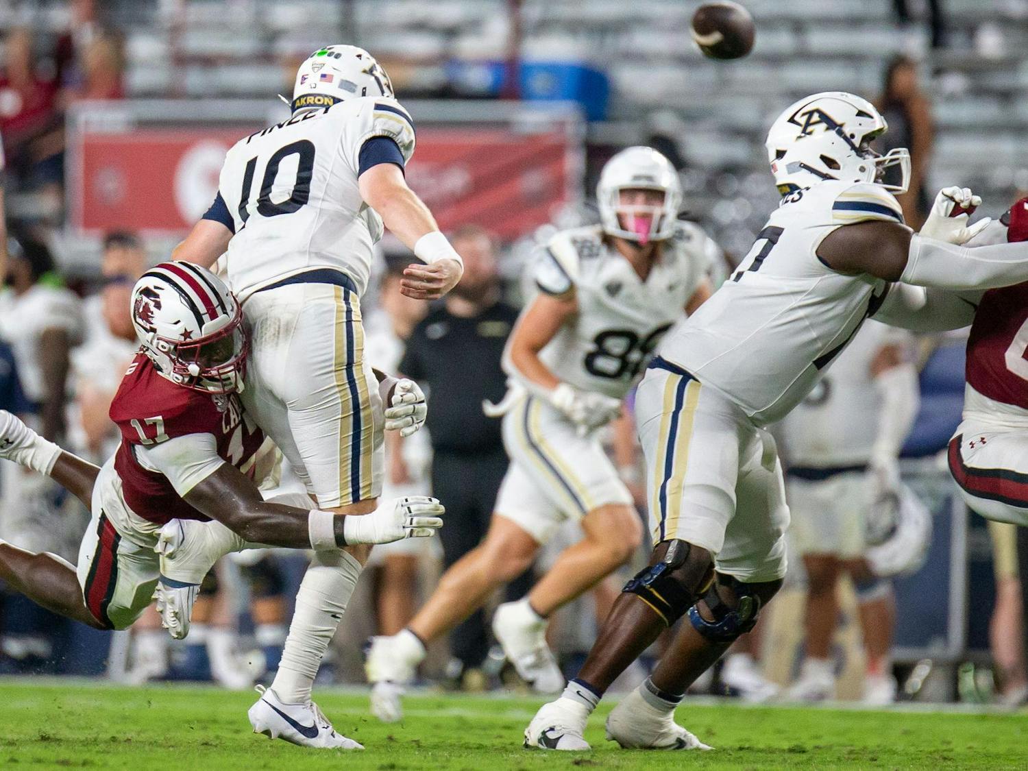 Sixth year linebacker Demetrius Knight Jr. goes for the tackle during South Carolina's game against Akron on Sept. 21, 2024 at Williams-Brice Stadium. Knight, who transferred from Charlotte, is in his first season with the Gamecocks.