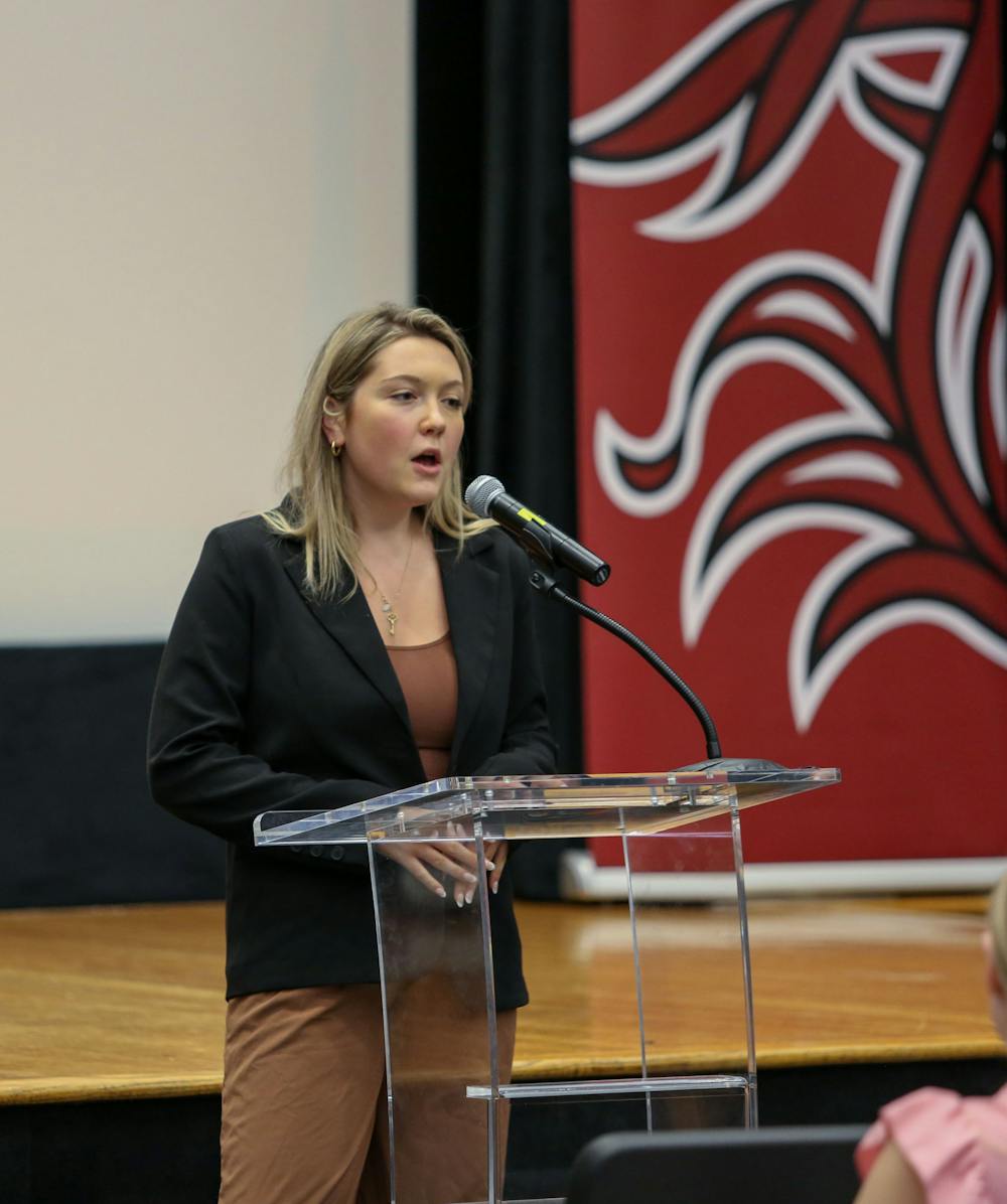 <p>FILE—Student Body Treasurer Hannah Augsbach Lamma at 115th student senate on April 5, 2023. Augsbach Lamma gave updates from the treasurer's office to the student senate.</p>