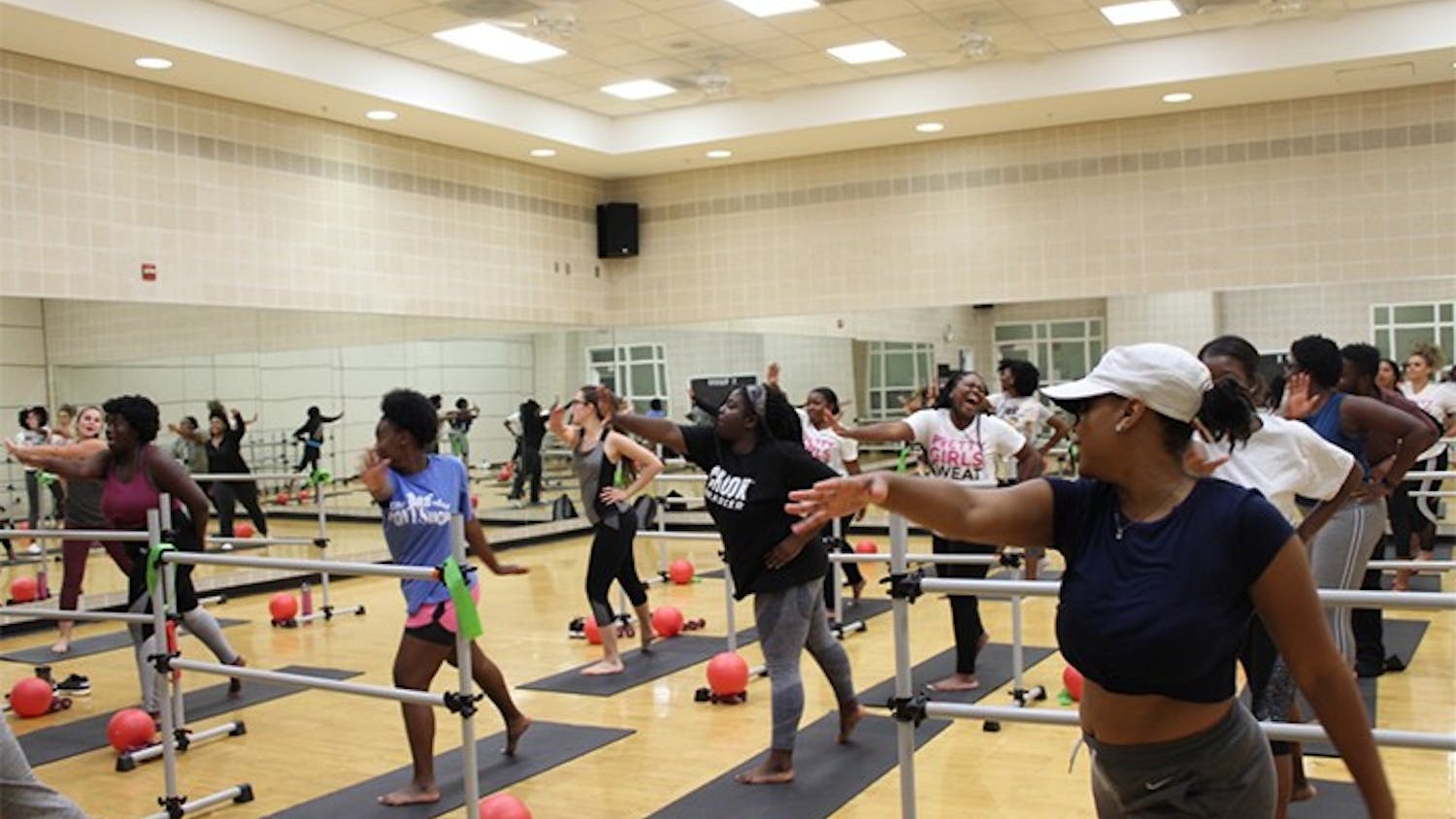 Members of USC's PRETTY GIRLS SWEAT chapter exercise in Strom Thurmond Wellness and Fitness Center. The members use a variety of equipment during their sessions.