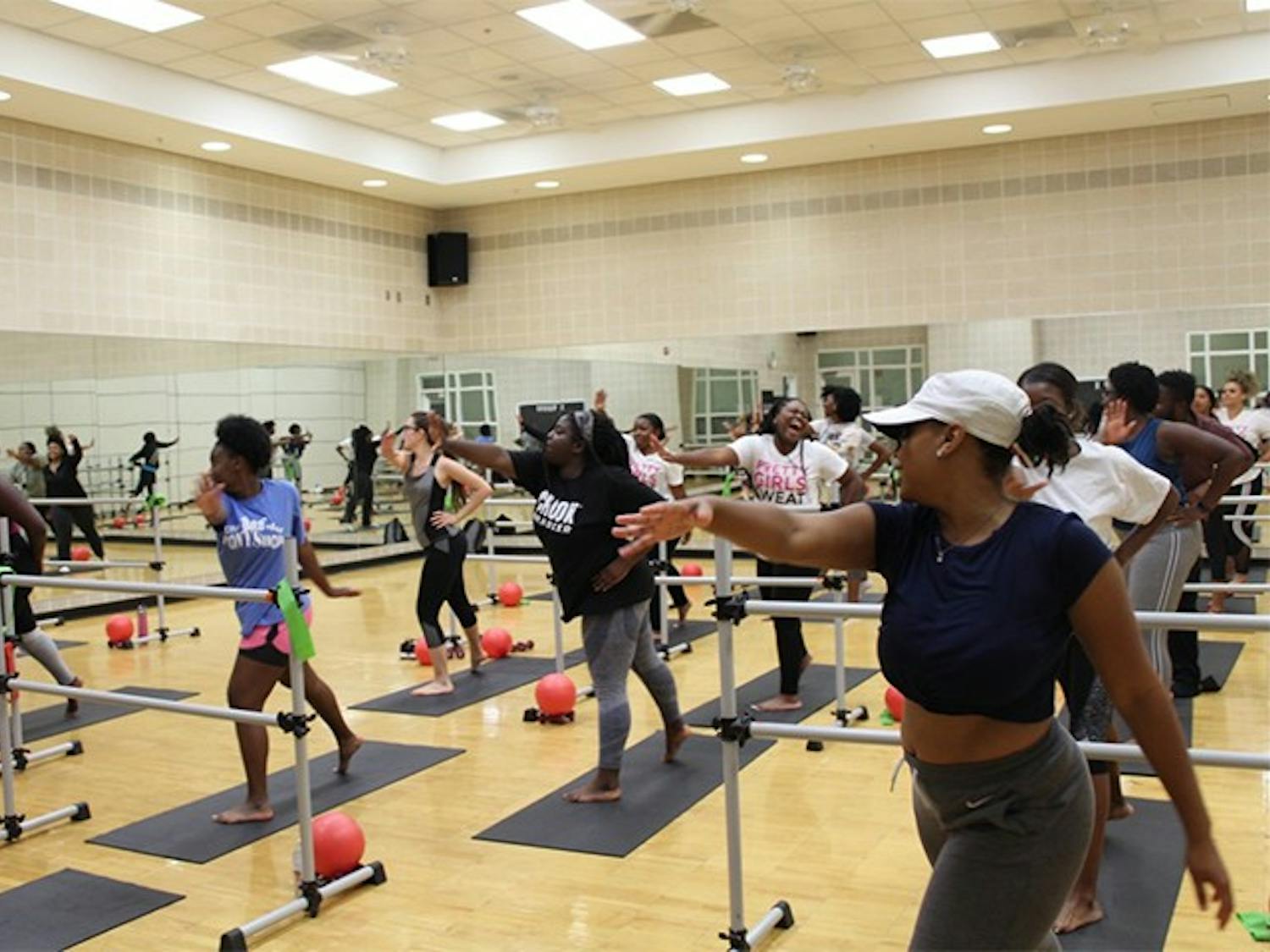 Members of USC's PRETTY GIRLS SWEAT chapter exercise in Strom Thurmond Wellness and Fitness Center. The members use a variety of equipment during their sessions.