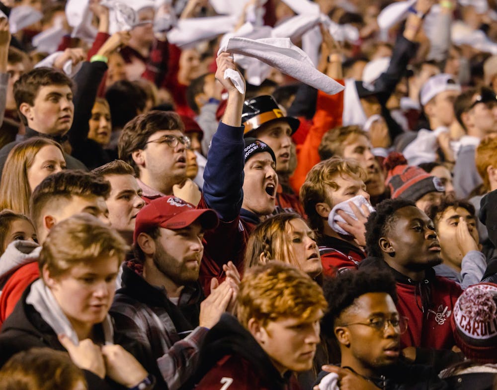 <p>Students cheer for the Gamecocks as they play in the Palmetto Bowl against the Clemson Tigers on Nov. 27, 2021. The Tigers beat the Gamecocks 30-0.&nbsp;</p>