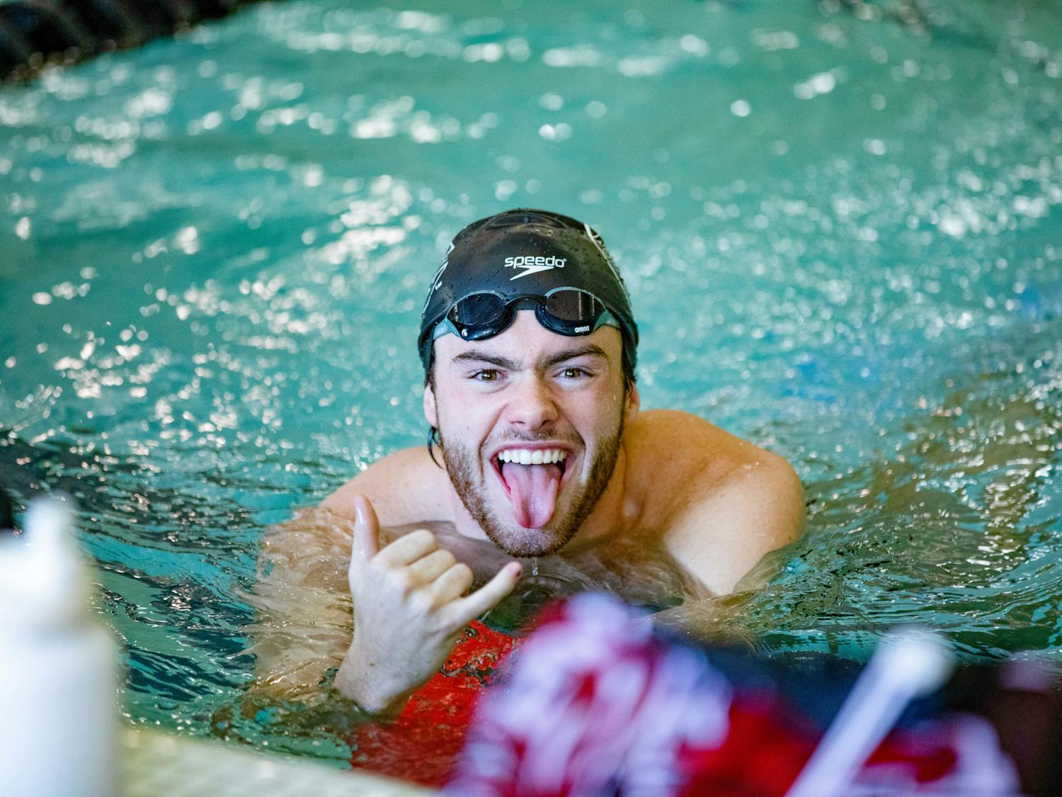 Senior IM swimmer Luke DeVore fires himself up before his race against the LSU Tigers on Oct. 8, 2022. The women’s swim and dive team won 161.5-138.5 while the men’s swim and dive team lost 143-157 against the LSU Tigers.
