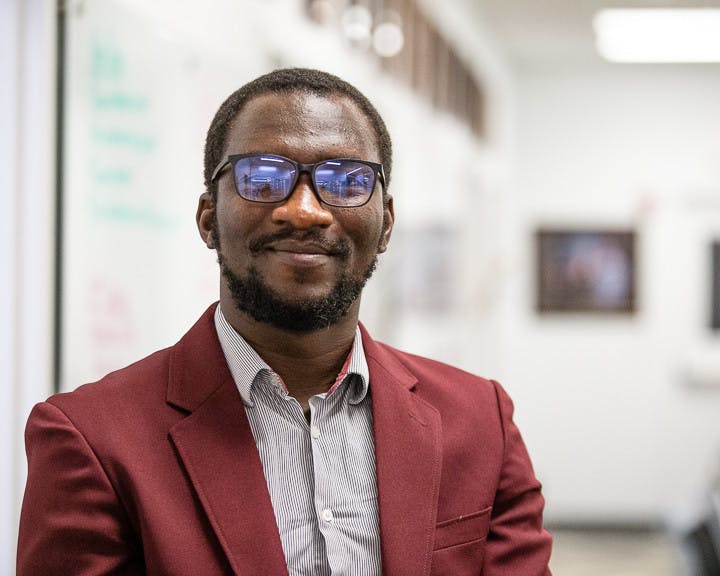 Fourth-year Ph.D. student Maxwell Akonde poses in front of the Leadership and Service center located inside Russell House on October 6, 2022. Akonde is the president of the Graduate Student Association at the University of South Carolina.