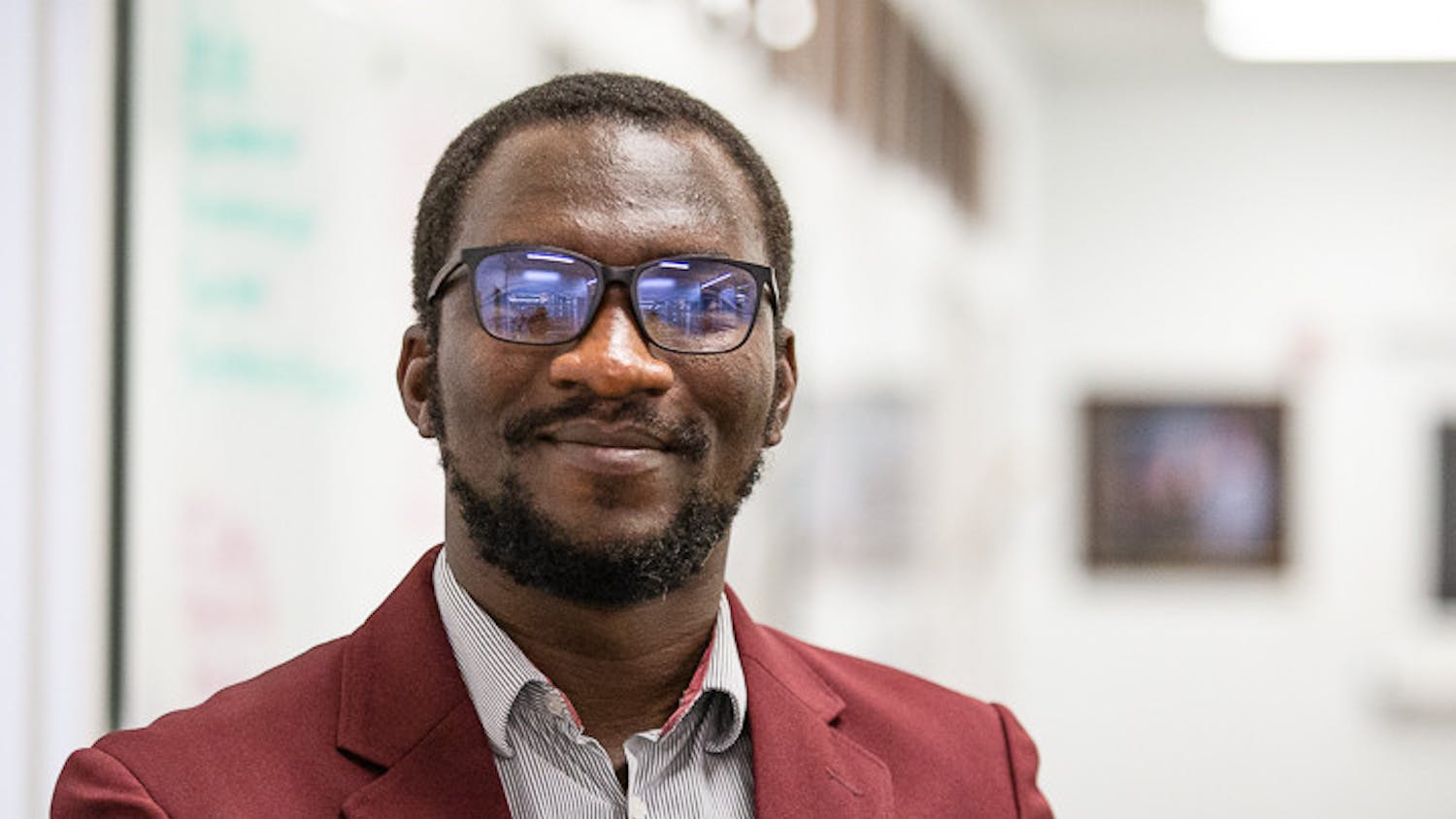 Fourth-year Ph.D. student Maxwell Akonde poses in front of the Leadership and Service center located inside Russell House on October 6, 2022. Akonde is the president of the Graduate Student Association at the University of South Carolina.