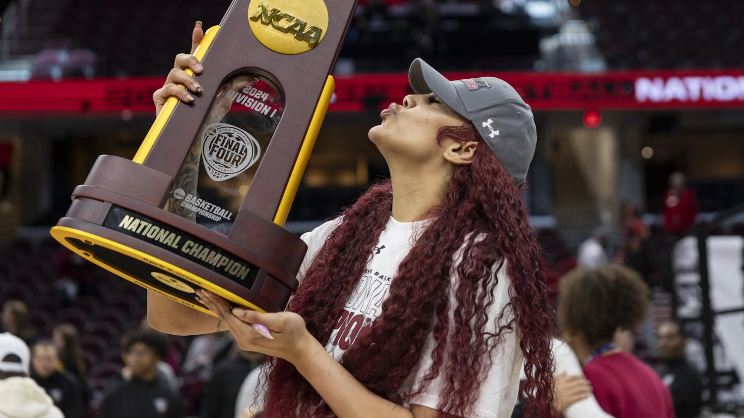 Senior center Kamilla Cardoso blows a kiss on the NCAA champion trophy on the court of Rocket Mortgage FieldHouse on April 8, 2024. Cardoso earned the NCAA Final Four Most Outstanding Player award.