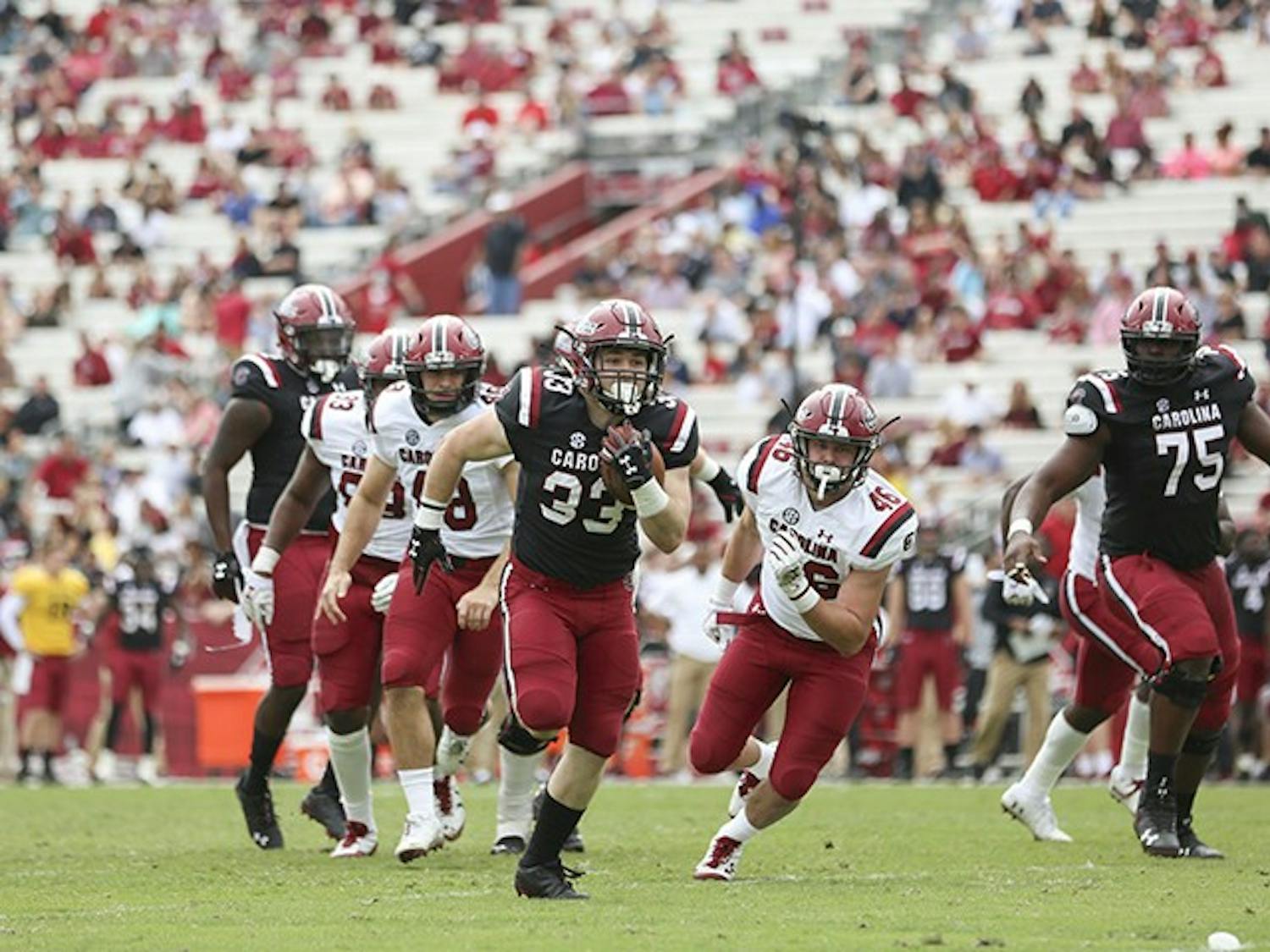 Redshirt junior Slade Carroll runs down the field to score a touchdown during the spring game at Williams-Brice Stadium on Saturday.&nbsp;