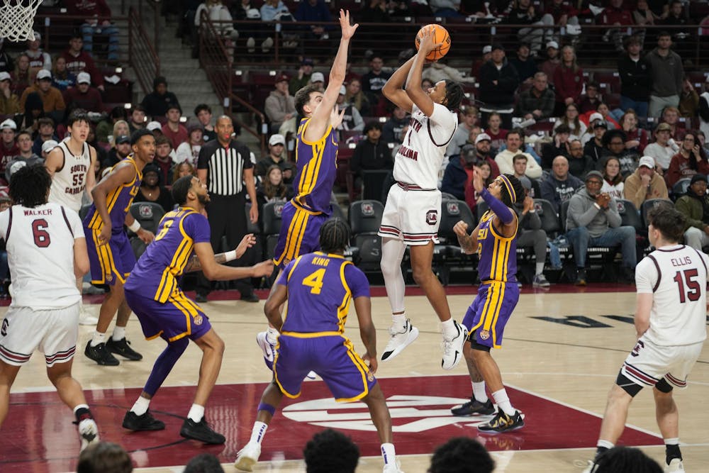 <p>South Carolina redshirt senior guard Kobe Knox elevates for a mid-range jumper as multiple LSU defenders contest the shot during the Gamecocks’ overtime loss to the Tigers at Colonial Life Arena on Jan. 31, 2026. The crowded paint and physical defense defined the intensity of the matchup.</p>