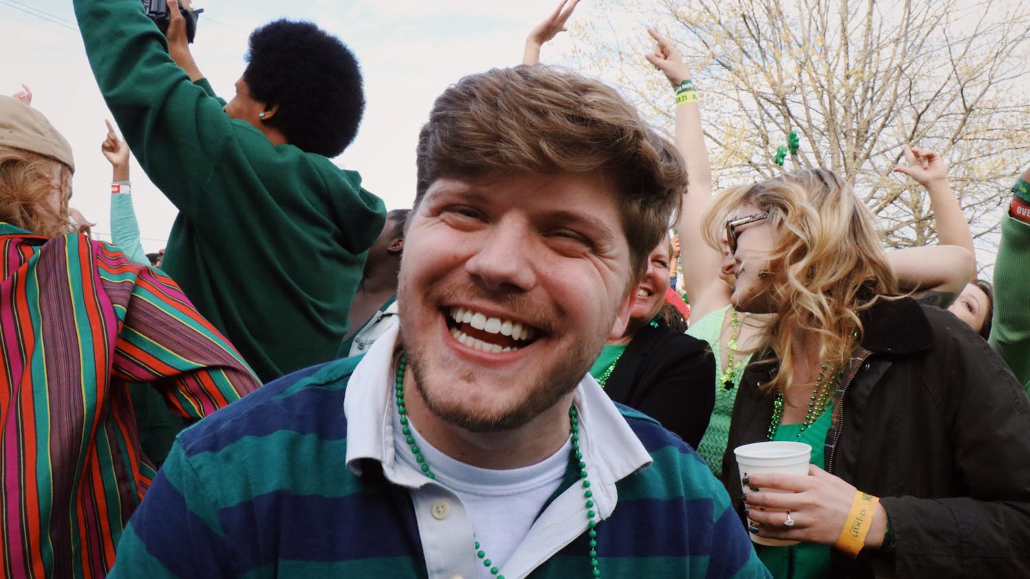 A festival attendee smiles while celebrating at the St. Pat's in Five Points event on March 18, 2023. Attendees had the opportunity to eat, drink, listen to music and much more at the celebration in downtown Columbia.&nbsp;