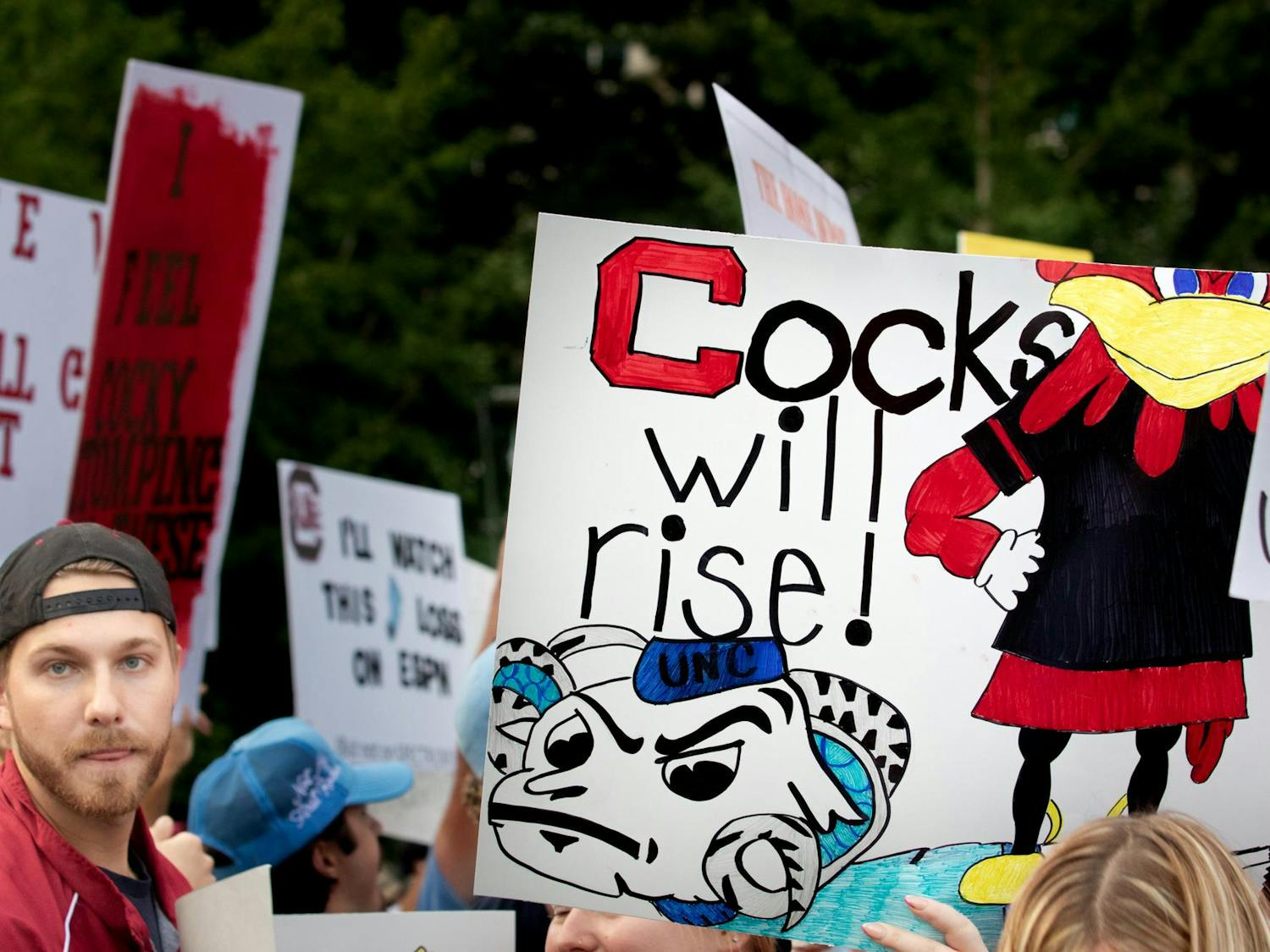 South Carolina fans show off their signs at College GameDay on Sept. 2, 2023. Some attendees say that they spent over two hours creating their signs.