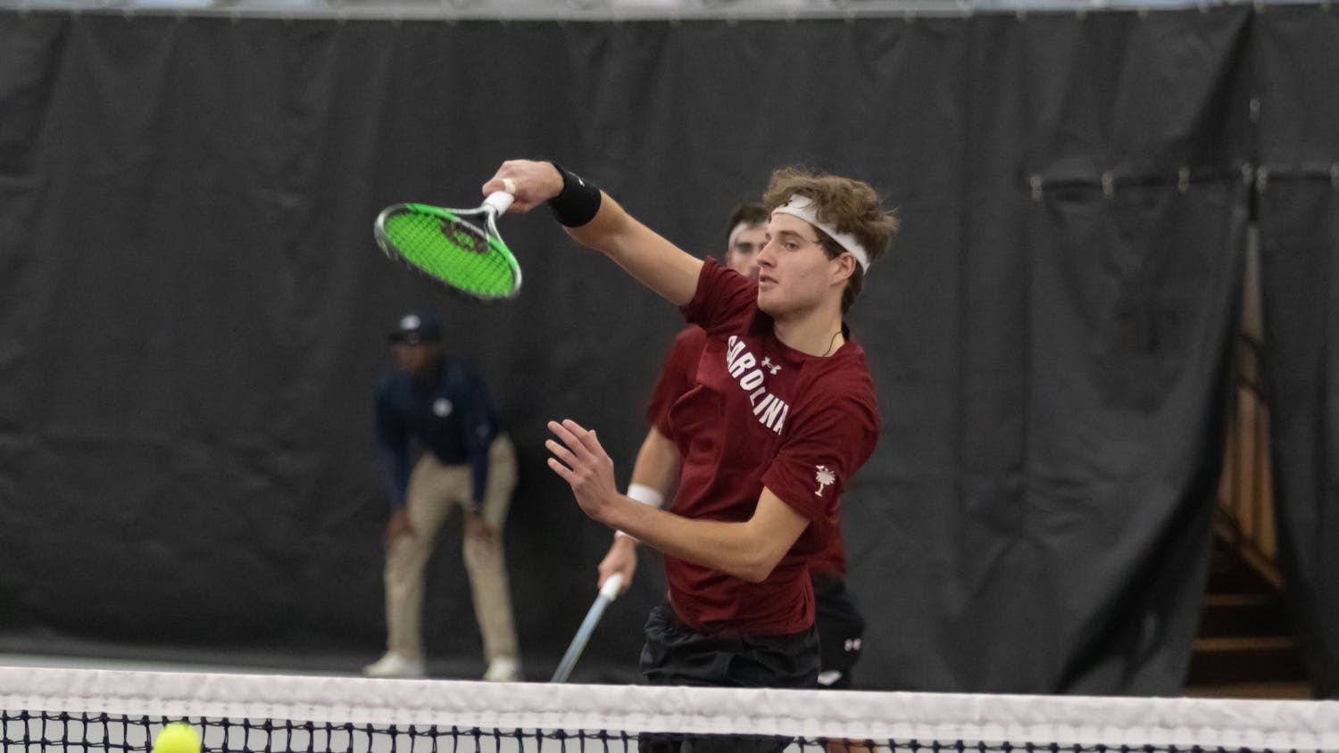 Junior Toby Samuel slams the ball to win a point during his doubles match with junior Connor Thomson at the ITA Kickoff Weekend event at the Carolina Indoor Tennis Center on Jan. 28, 2023. The South Carolina Gamecocks beat Penn 4-0.