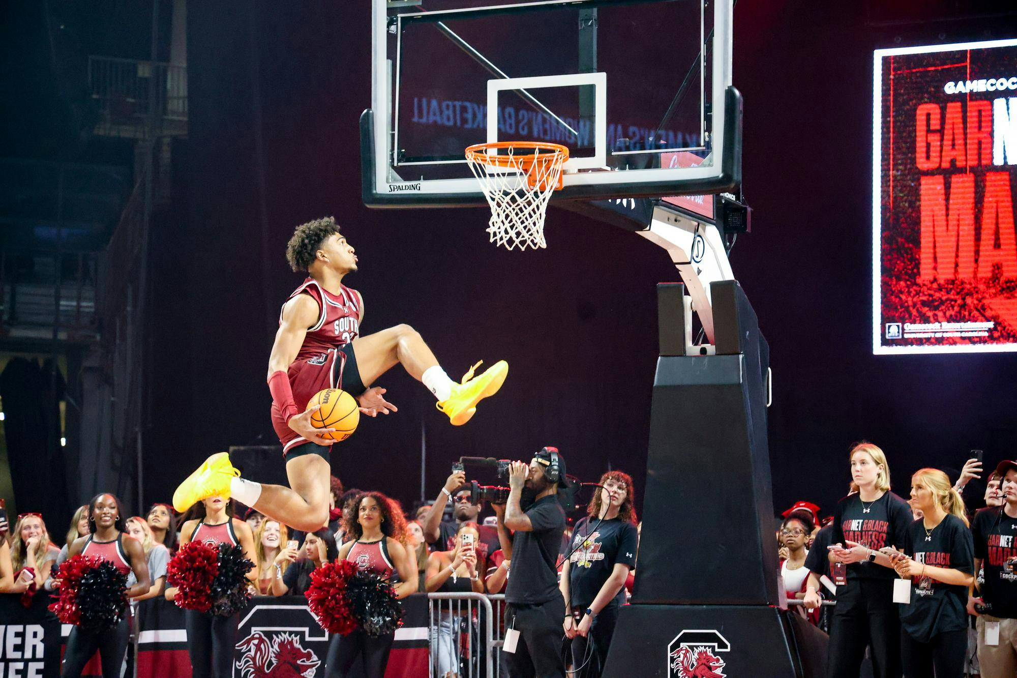 Freshman forward EJ Walker performs a dunk from under his leg during a dunking contest at GarNET &amp; Black Madness on Oct. 21, 2025, at Colonial Life Arena. The contest was judged by members of the women's basketball team and rapper Waka Flocka Flame