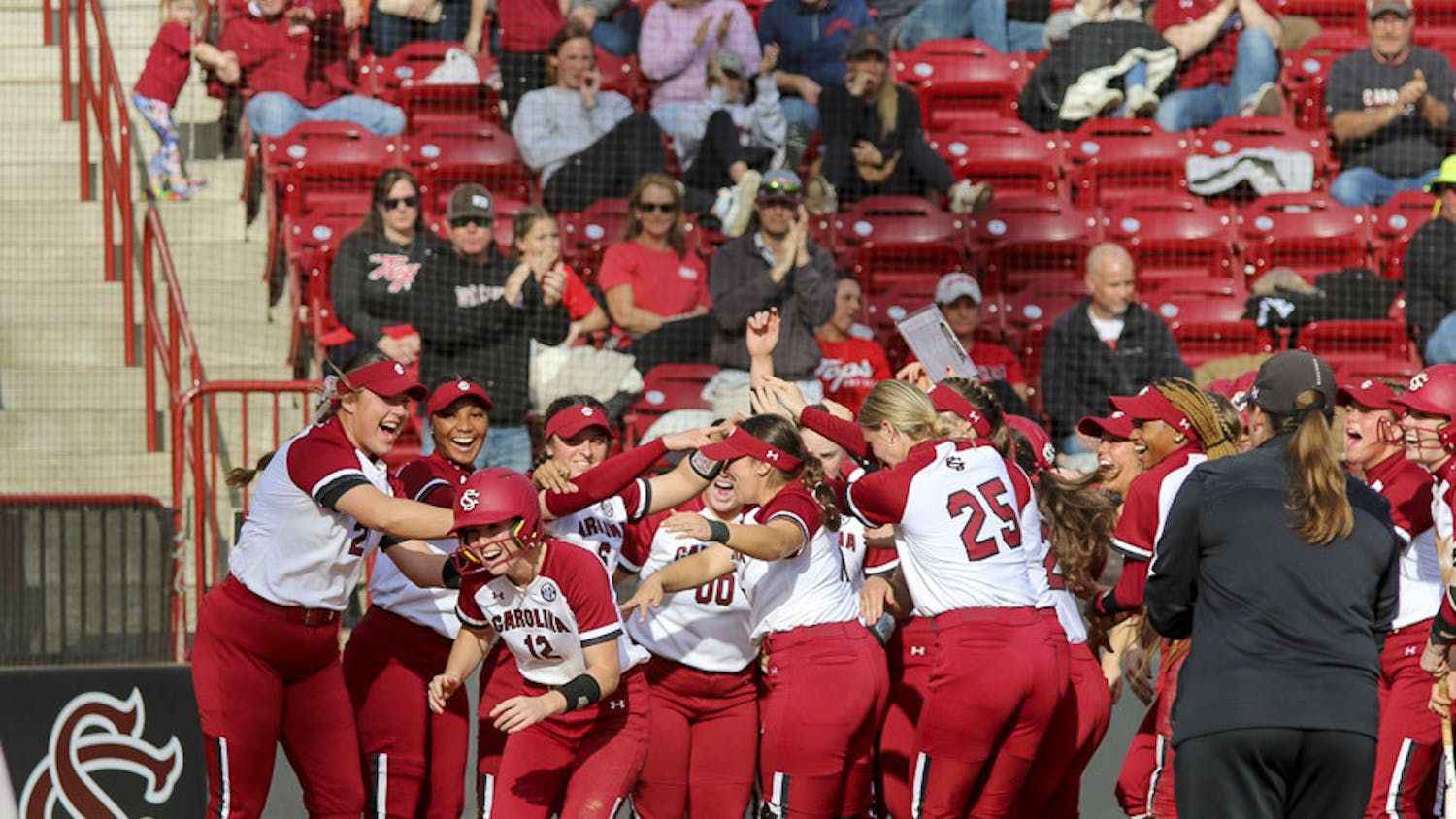 The Gamecock softball team celebrates after sophomore outfielder Marissa Gonzalez hits a grand slam during the matchup between South Carolina and Western Kentucky at Beckham Field on Feb. 19, 2023. The Gamecocks defeated the Hilltoppers 11-2.