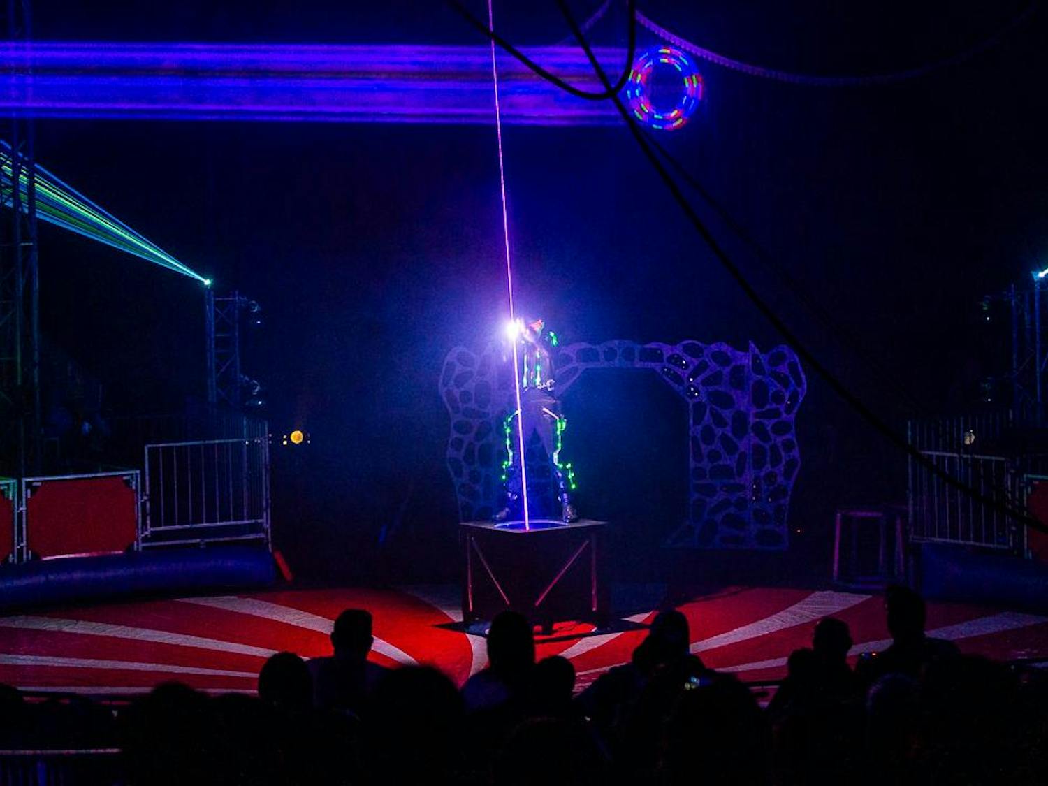 Laser Man Gimi Fornaciari pushes down on a laser to give the illusion that he can halt the light during his opening act at the CIRCUS at the Fair on Oct. 18, 2023. This was the artist's first year performing at the South Carolina State Fair.