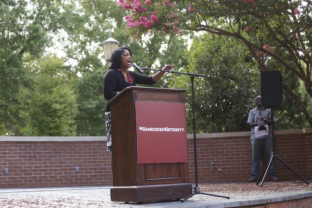 Dr. Jennifer Clyburn Reed speaks to rally attendees at Russell House on Wednesday afternoon.&nbsp;