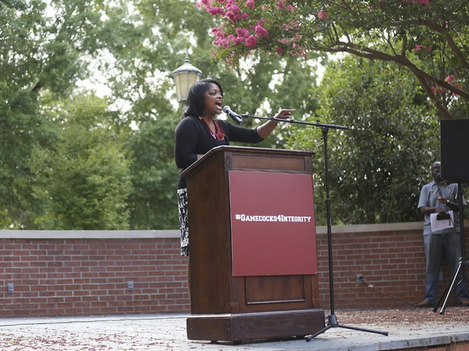 Dr. Jennifer Clyburn Reed speaks to rally attendees at Russell House on Wednesday afternoon.&nbsp;