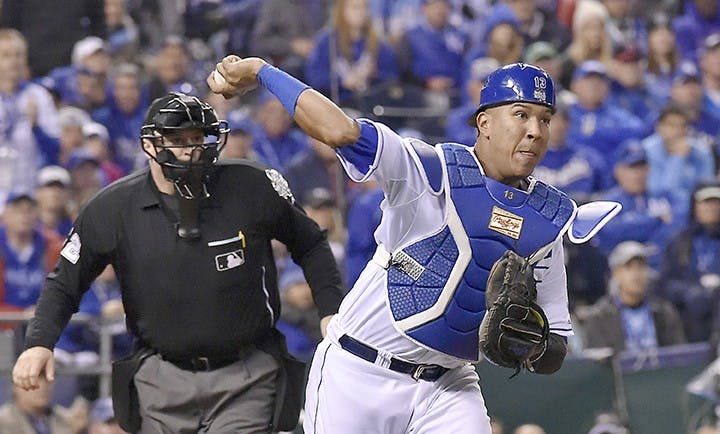 Kansas City Royals catcher Salvador Perez throws to first to retire the New York Mets&apos; Daniel Murphy on a third-strike wild pitch in the 12th inning in Game 1 of the World Series on Tuesday, Oct. 27, 2015, at Kauffman Stadium in Kansas City, Mo. (John Sleezer/Kansas City Star/TNS)