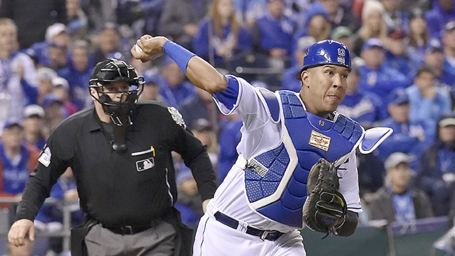 Kansas City Royals catcher Salvador Perez throws to first to retire the New York Mets&apos; Daniel Murphy on a third-strike wild pitch in the 12th inning in Game 1 of the World Series on Tuesday, Oct. 27, 2015, at Kauffman Stadium in Kansas City, Mo. (John Sleezer/Kansas City Star/TNS)