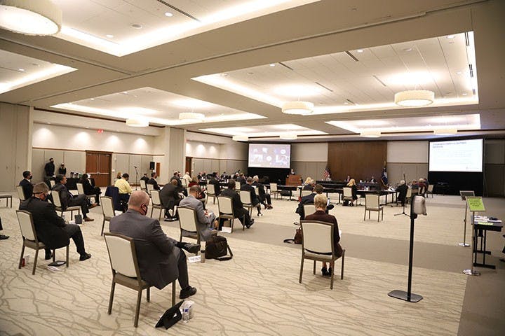 The board of trustees meeting in the Alumni Center ballroom on Friday, Oct. 9. The room had chairs spread out due to COVID-19 requirements, and the attendees wore masks.