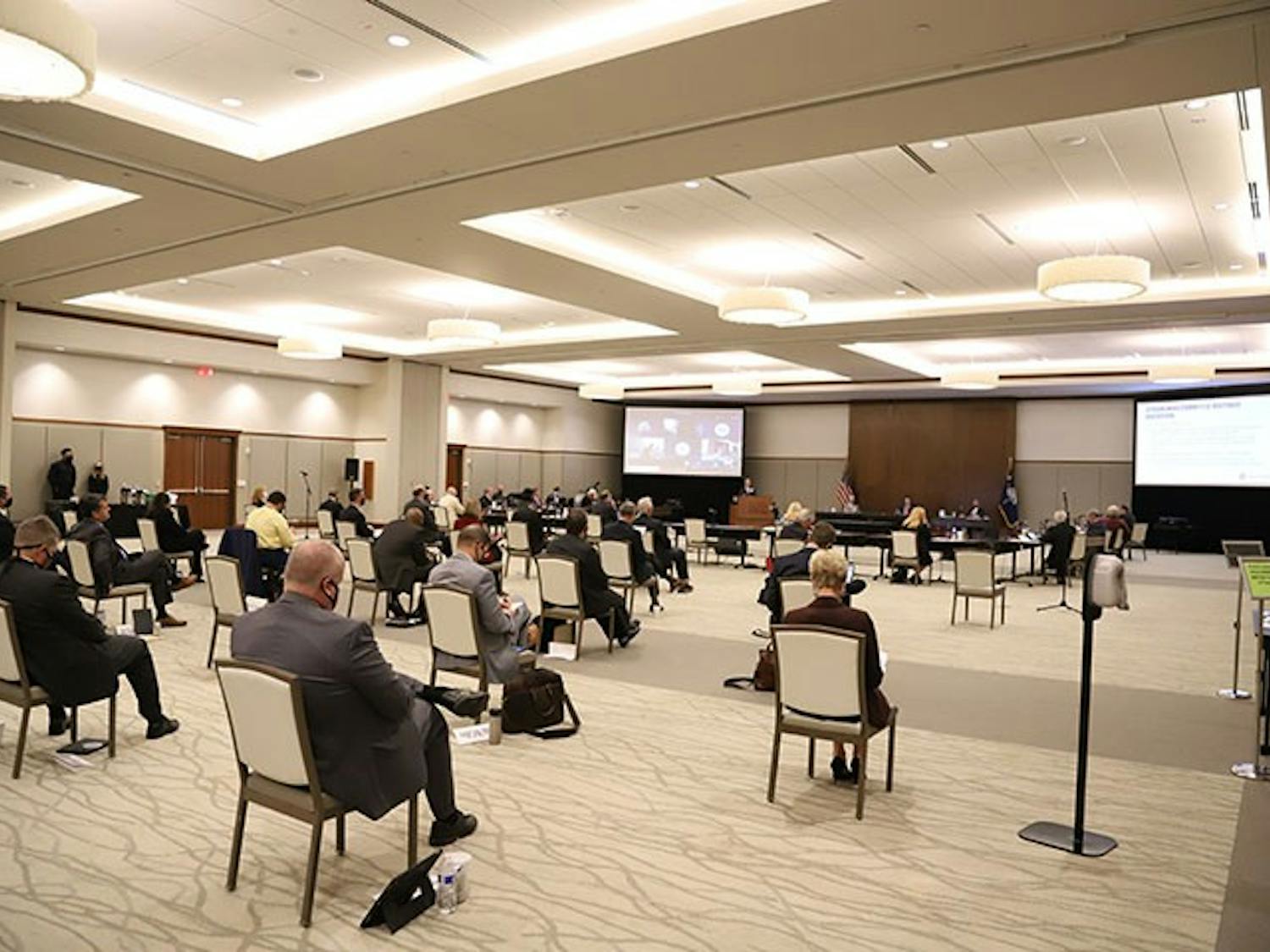 The board of trustees meeting in the Alumni Center ballroom on Friday, Oct. 9. The room had chairs spread out due to COVID-19 requirements, and the attendees wore masks.