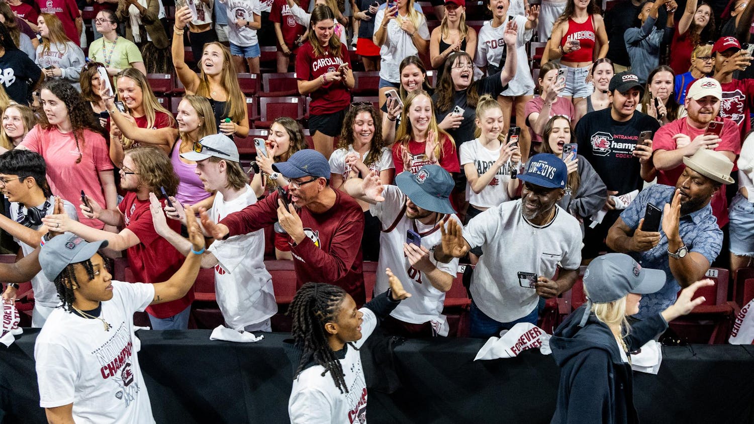 Sophomore forward Ashlyn Watkins, freshman guard MiLaysia Fulwiley and sophomore forward Chloe Kitts high five fans during a welcome home celebration for the 2024 NCAA Women's National Champions at the Colonial Life Arena on April 8, 2024. The Gamecocks defeated the Iowa Hawkeyes 87-75 at Rocket Mortgage FieldHouse in Cleveland, Ohio on Sunday, April 7, 2024.