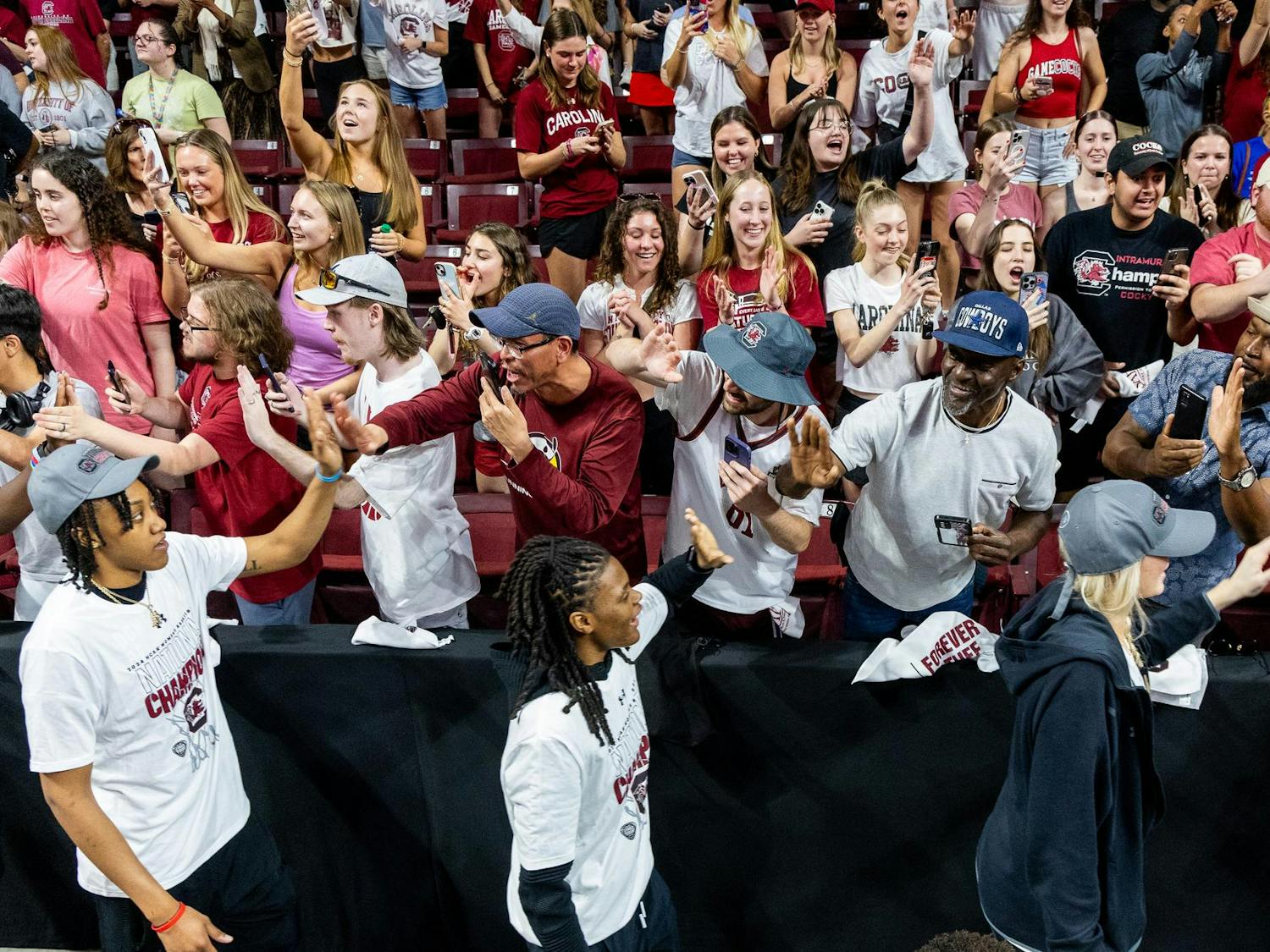 Sophomore forward Ashlyn Watkins, freshman guard MiLaysia Fulwiley and sophomore forward Chloe Kitts high five fans during a welcome home celebration for the 2024 NCAA Women's National Champions at the Colonial Life Arena on April 8, 2024. The Gamecocks defeated the Iowa Hawkeyes 87-75 at Rocket Mortgage FieldHouse in Cleveland, Ohio on Sunday, April 7, 2024.