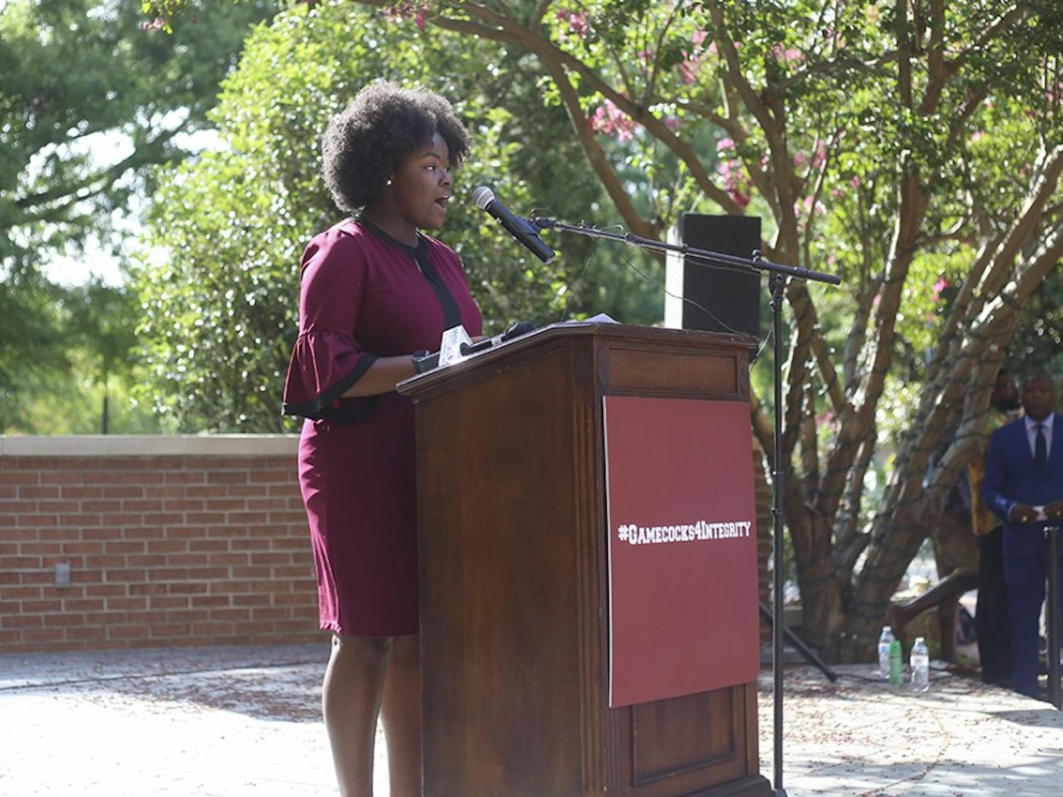 Fourth-year sports and entertainment management major Lyric Swinton speaks to faculty &amp; students during the rally at Russell House on Wednesday afternoon.&nbsp;