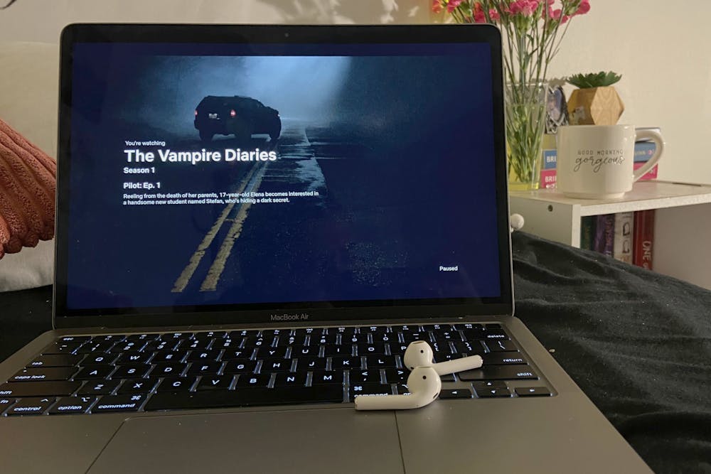 A clip from The Vampire Diaries is shown on a laptop screen. The Vampire Diaries is a great show to get you in the spirit of fall, according to columnist Julia Goulet.