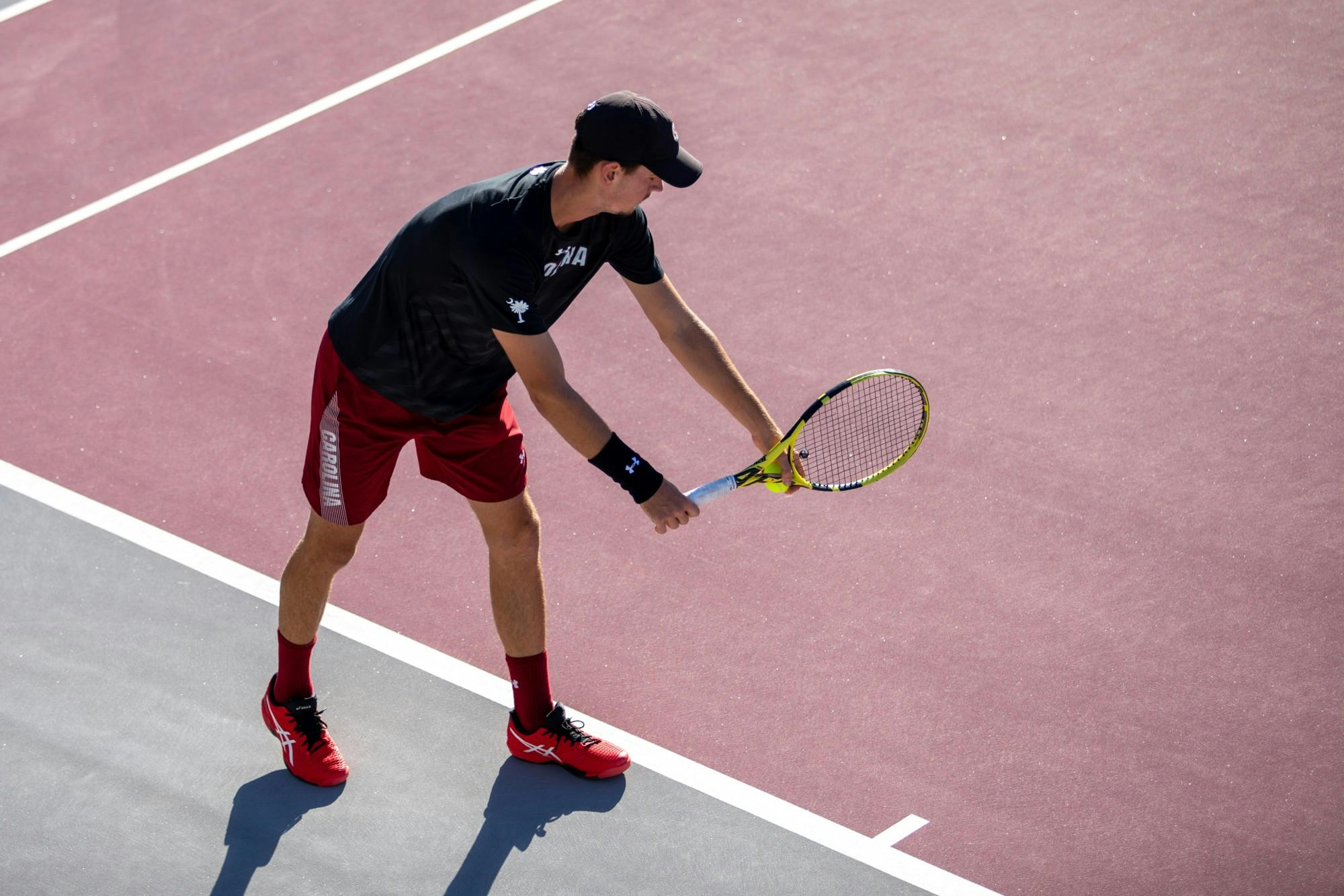 FILE—Junior Raphael Lambling prepares to serve to his opponent during a match on October 31, 2021. The Gamecocks beat LSU 4-1 on January 29, 2022 in Columbia, SC.
