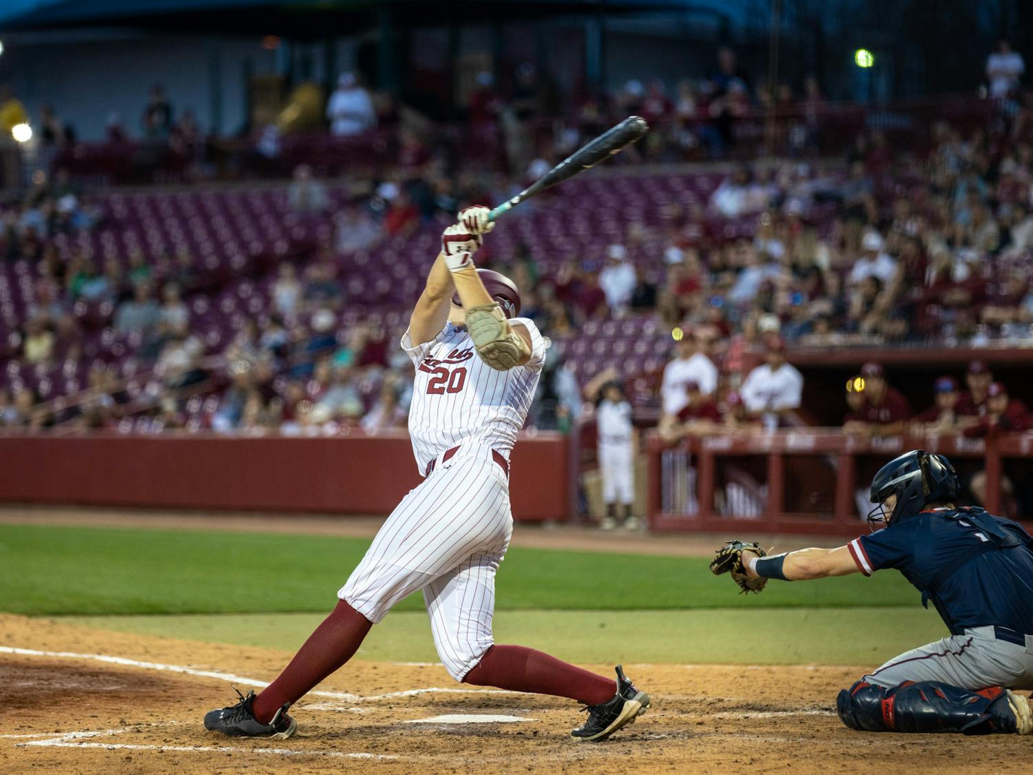 Attempting to hit the ball, freshman infielder and pitcher Ethan Petry makes a full swing during the South Carolina matchup against UPenn on Feb. 24, 2023, at Founders Park. South Carolina had won both games so far in its three-game series, with the first score being 7-4 and the other 1-0.