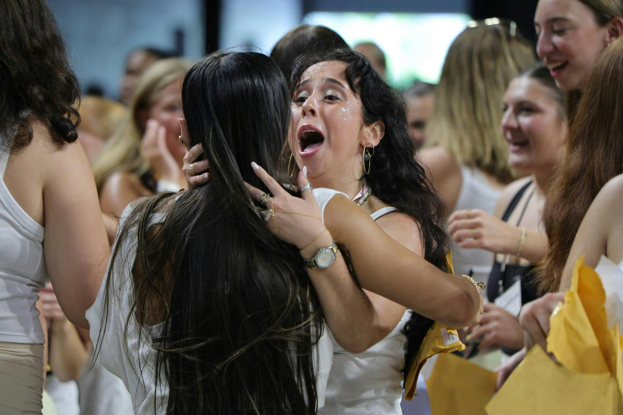 A new member of Gamma Phi Beta shares an emotional moment with a sorority member during Bid Day on Aug. 16, 2026, at Colonial Life Arena. Tears and embraces filled the arena as students found their new sororities.