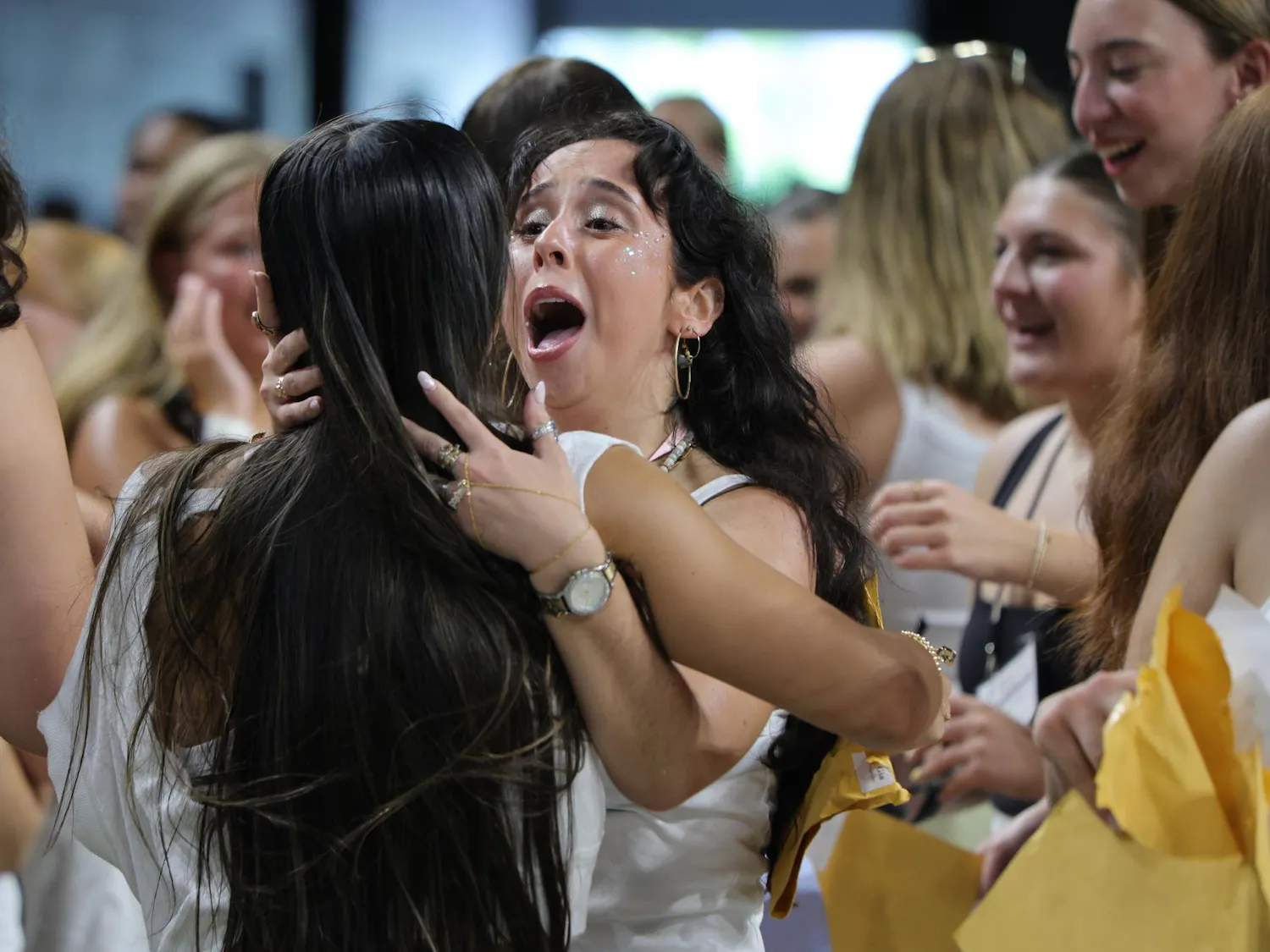 A new member of Gamma Phi Beta shares an emotional moment with a sorority member during Bid Day on Aug. 16, 2026, at Colonial Life Arena. Tears and embraces filled the arena as students found their new sororities.