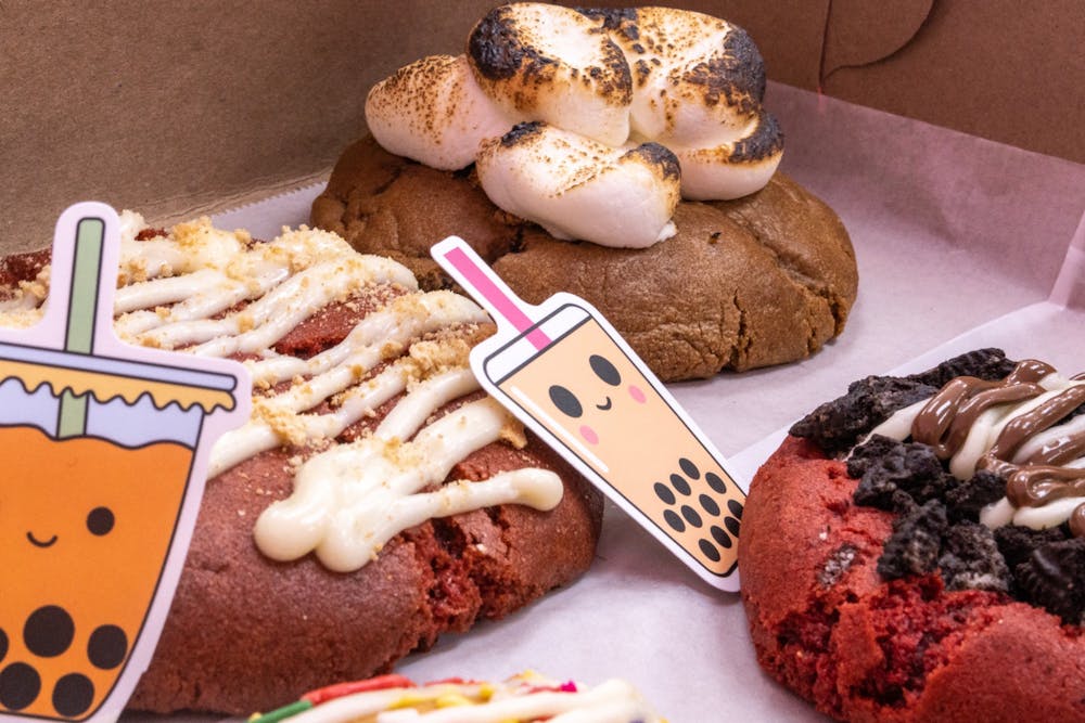 <p>An assortment of cookies from Mingos Cookies shop in Lexington on Feb. 14, 2022. The cookie and bubble tea shop offers a large variety of specialty cookies ranging from Oreo topped red velvet cookies, as well as sugar cookies with Cinnamon Toast Crunch crumbles.</p>