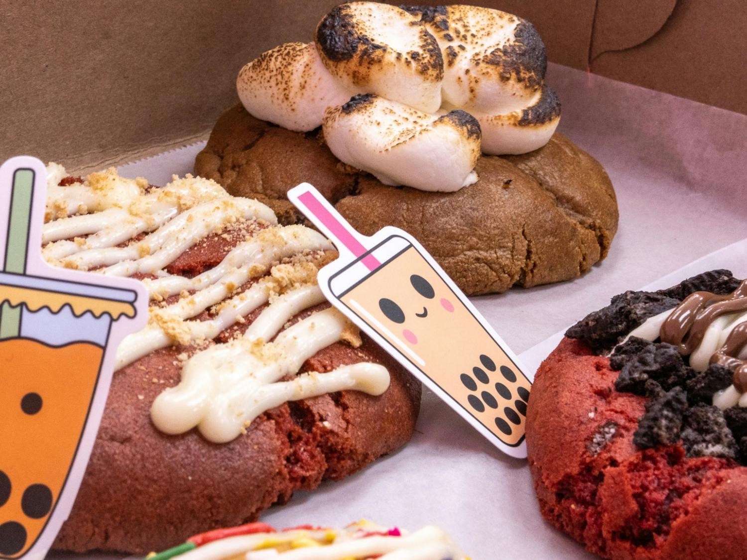 An assortment of cookies from Mingos Cookies shop in Lexington on Feb. 14, 2022. The cookie and bubble tea shop offers a large variety of specialty cookies ranging from Oreo topped red velvet cookies, as well as sugar cookies with Cinnamon Toast Crunch crumbles.