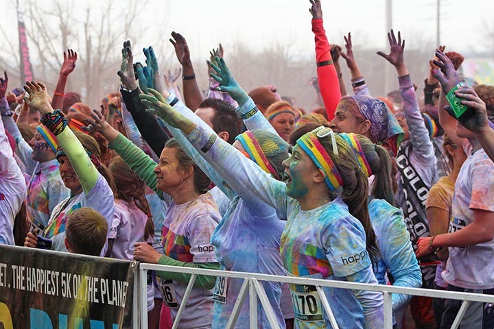 	The crowd of runners reaches out in support of the on going show. 
Heidi Stone/The Daily Gamecock