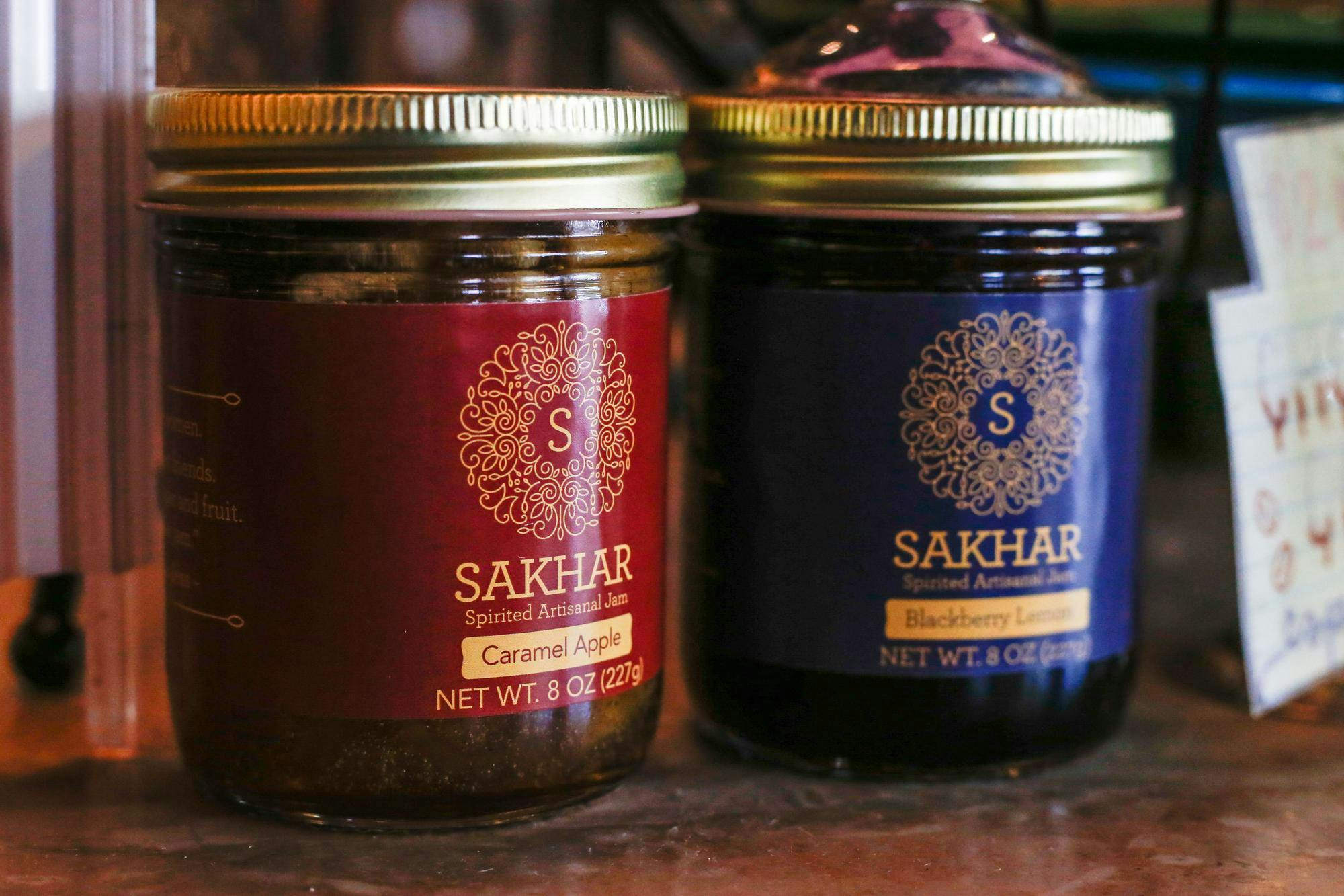Two jars of Sahkar Spirited Artisanal Jam are displayed on the counter of Drip Coffee located at 729 Saluda Avenue in the Five Points area of Columbia, S.C. Drip is one of a number of local business that sell or utilize Sahkar products in their menu.