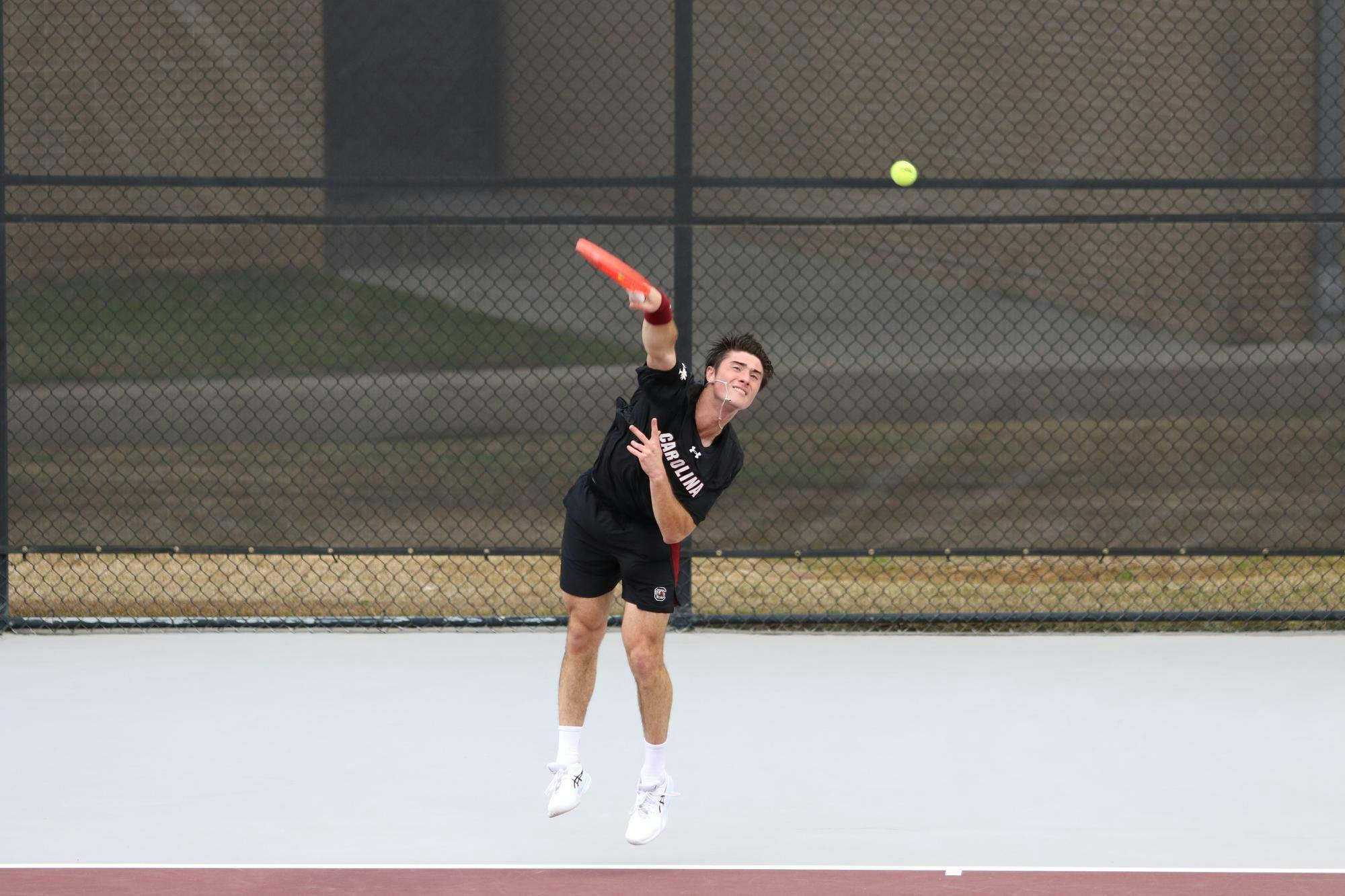Sophomore Atakan Karahan serves during his singles match against Longhorn freshman Abel Forger Feb. 27, 2026. Karahan fell to Forger, 6-2, 6-2.